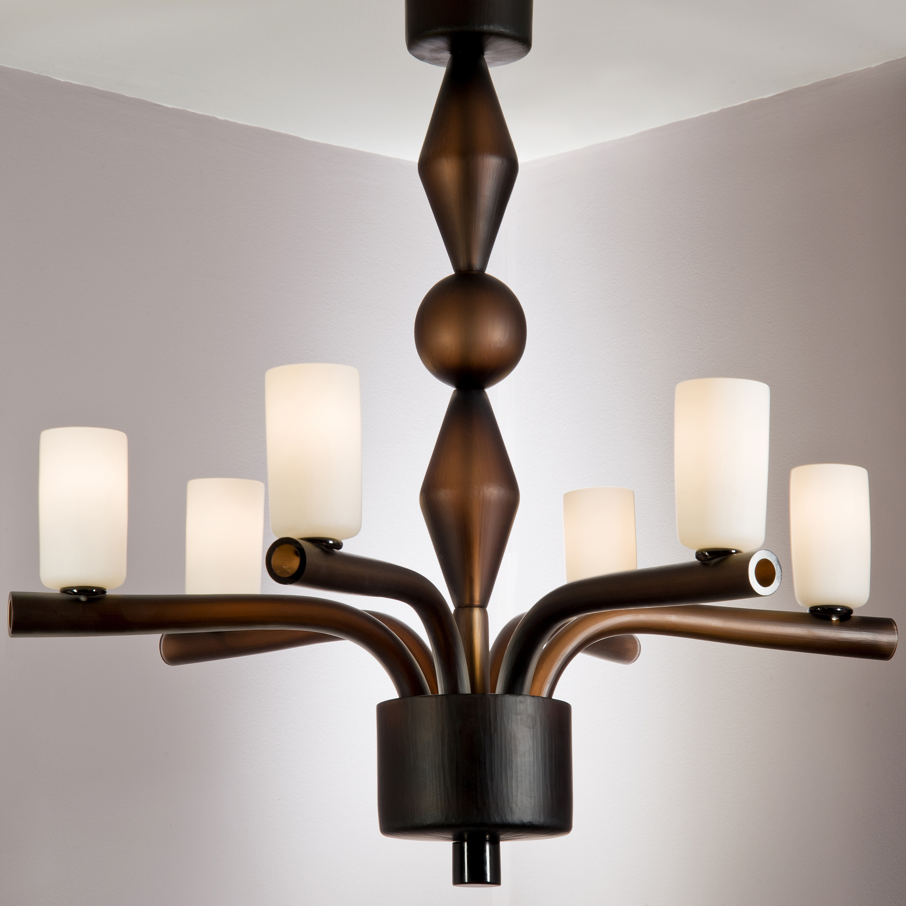 steel frame chandelier with six arms holding blown glass cups