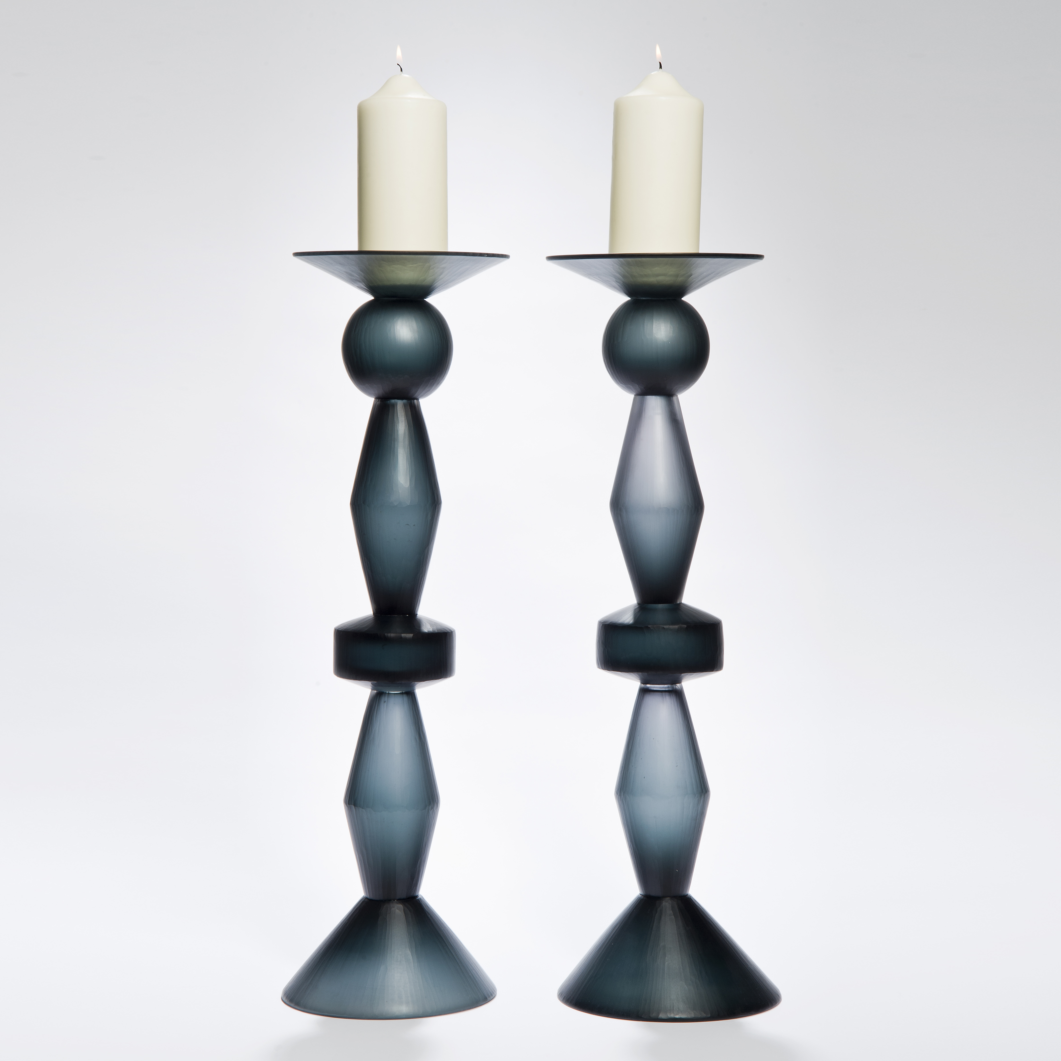 two art glass candlesticks in dark blue