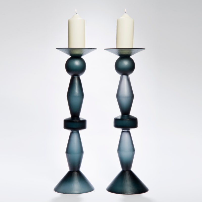 two art glass candlesticks in dark blue