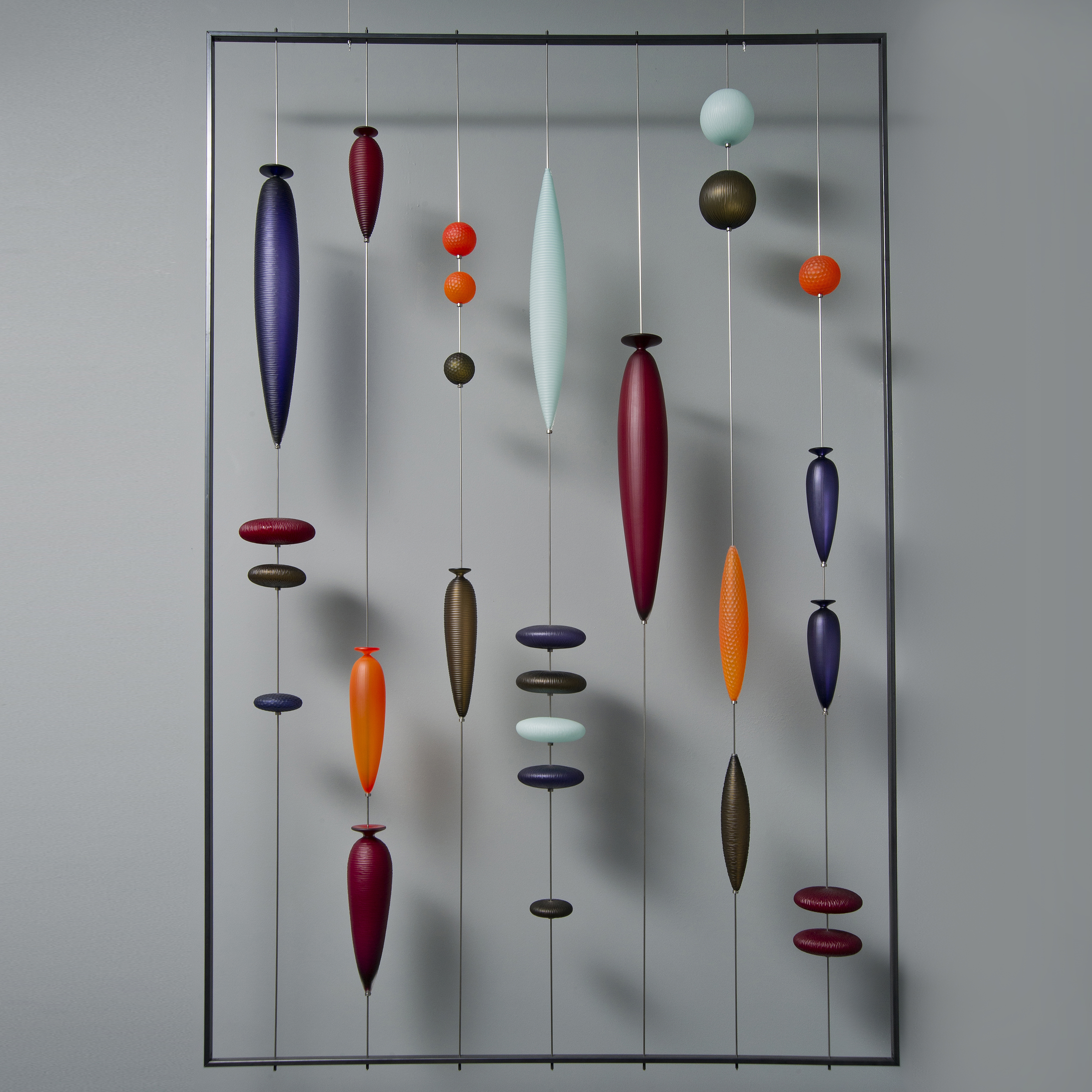 wall-mounted blown glass art sculpture with steel frame
