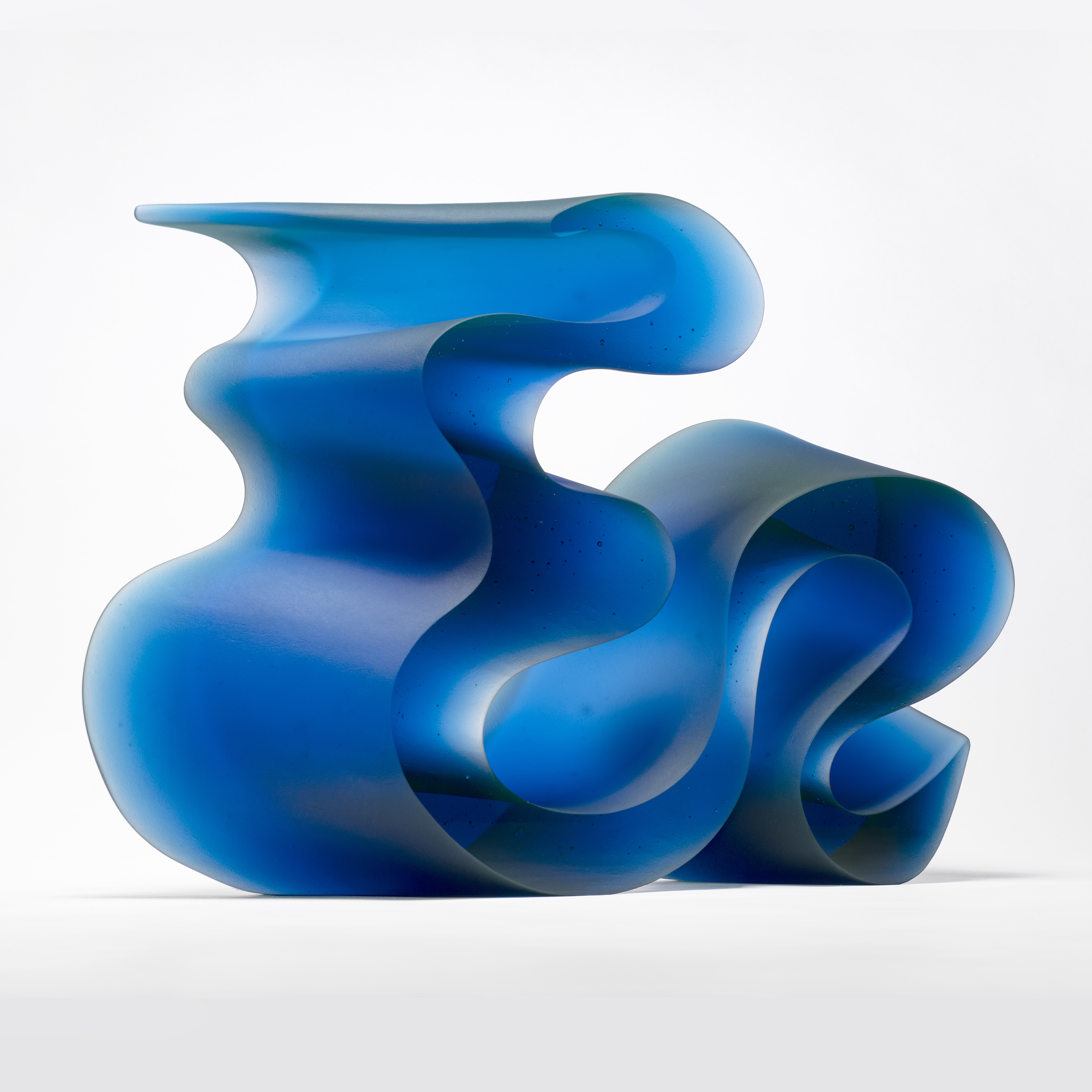 abstract geometrical contemporary sculpture in blue cast glass 