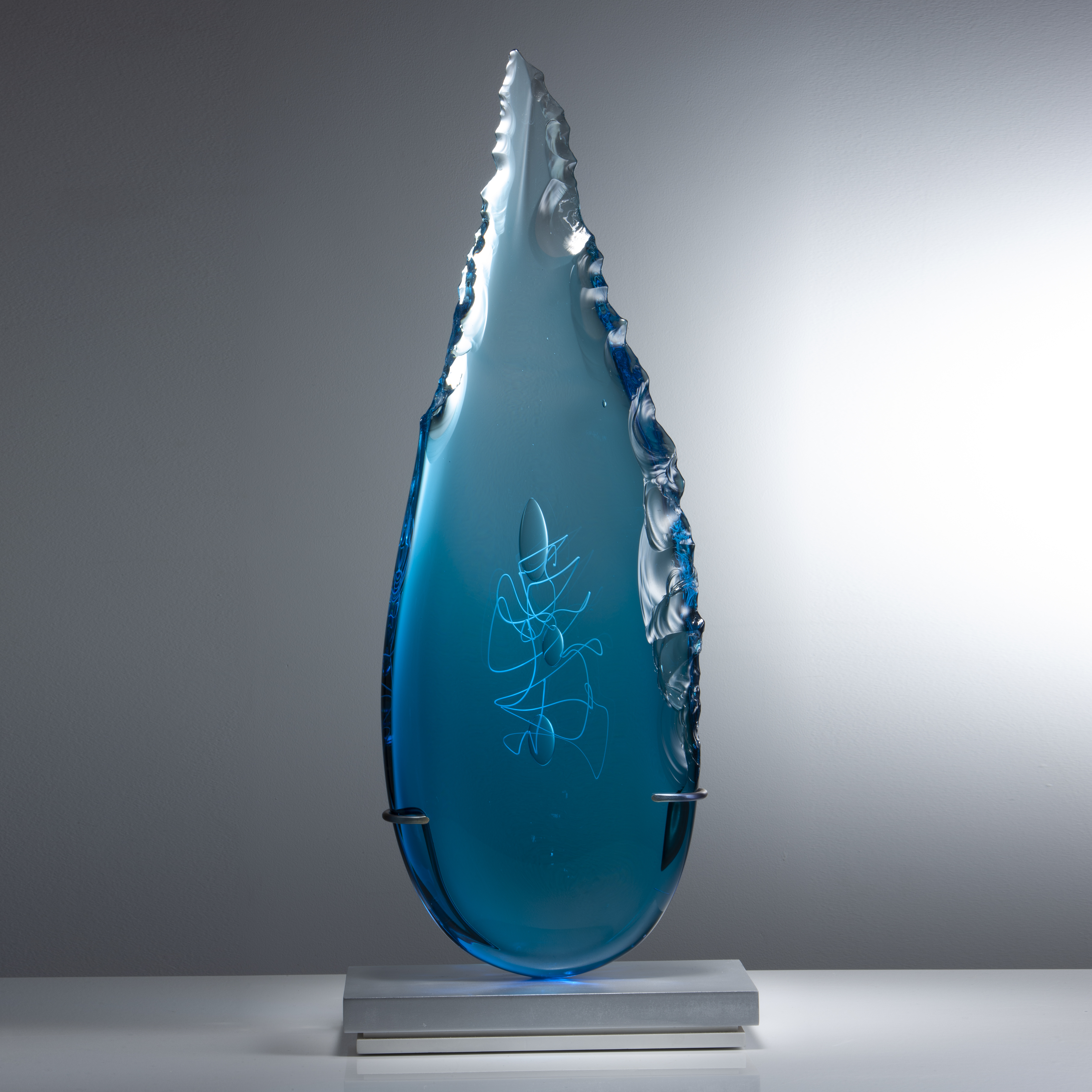 electric blue art glass sculpture in leaf shape