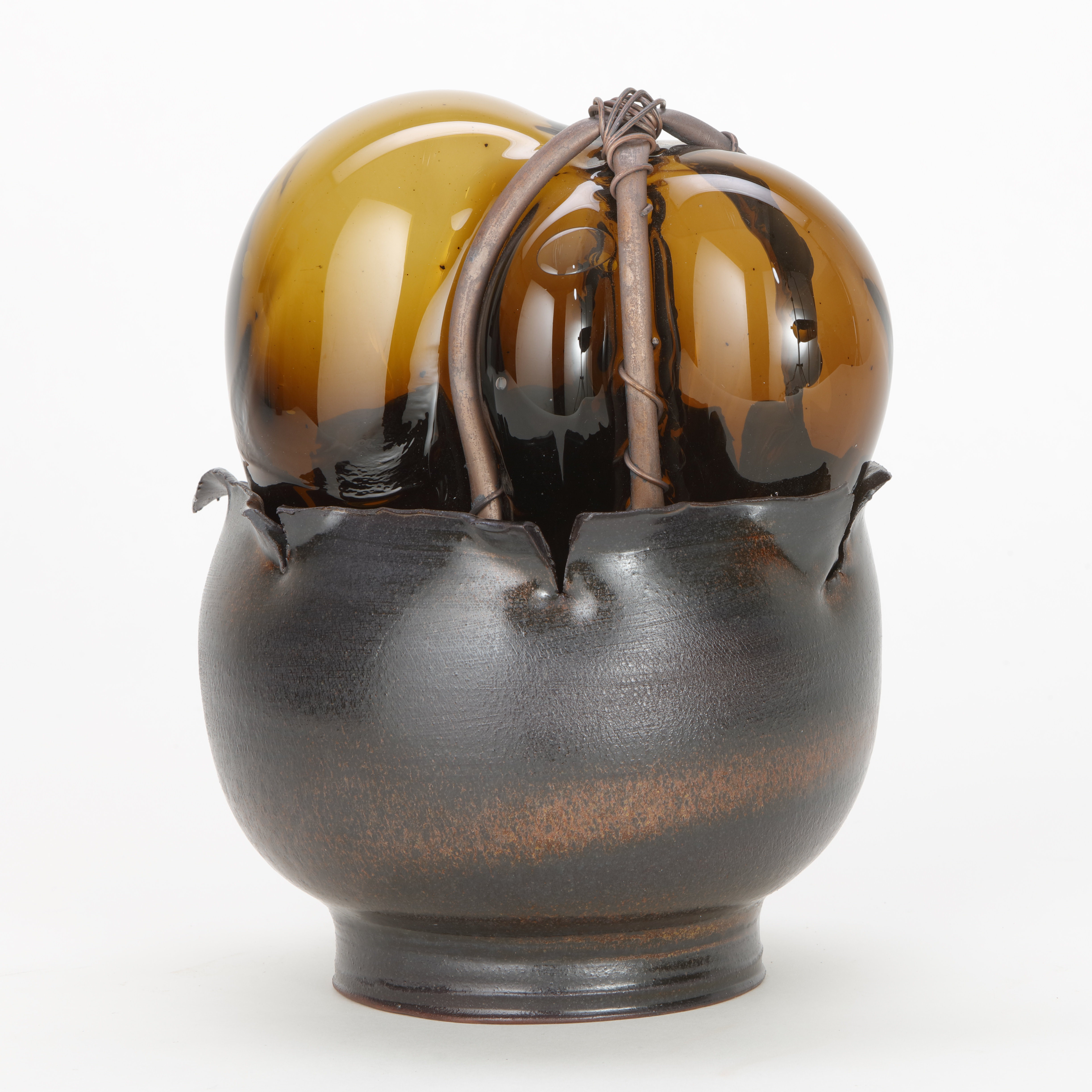 handblown and sculpted modern art glasswork of heart shaped glass in copper wire