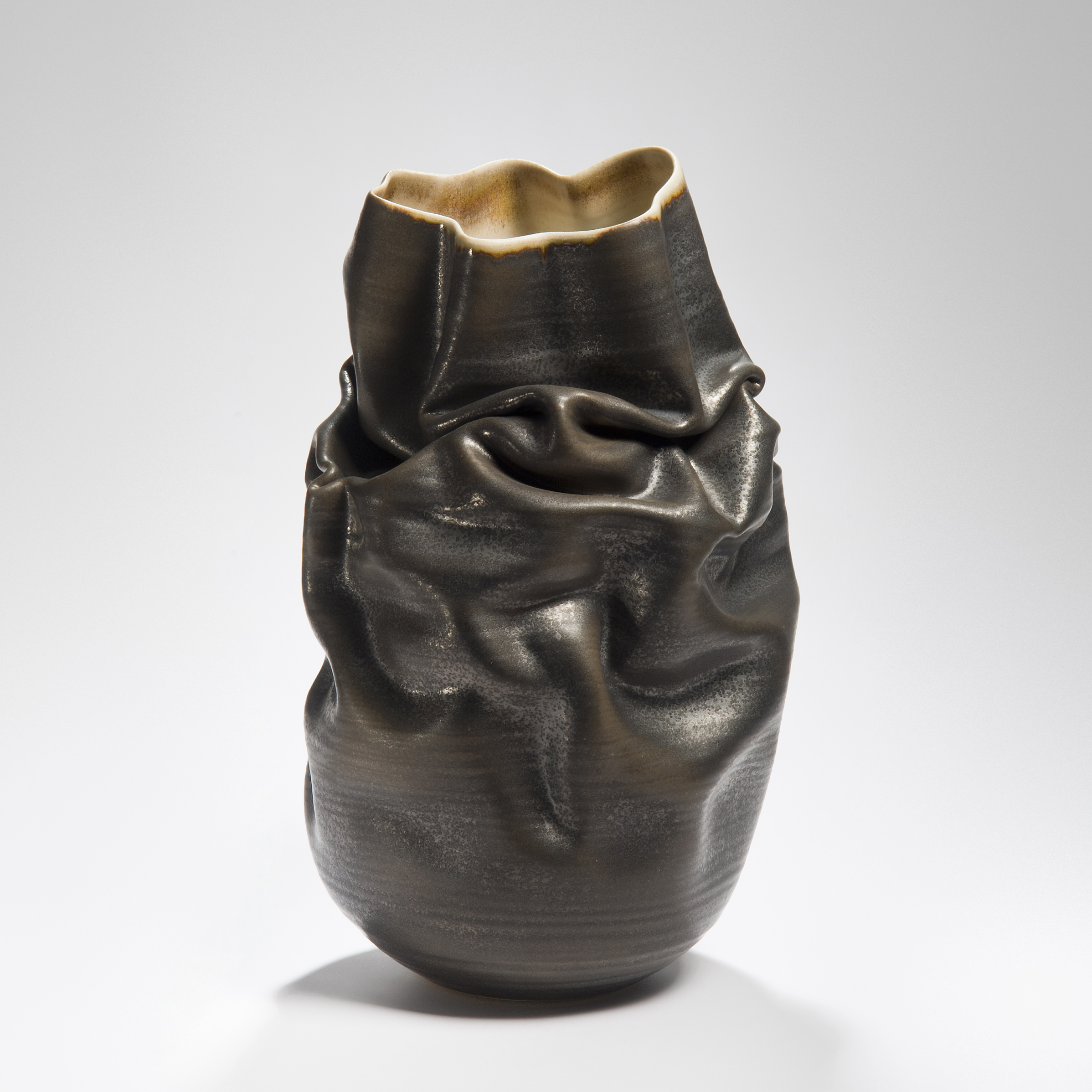 crumpled black stoneware clay vase art
