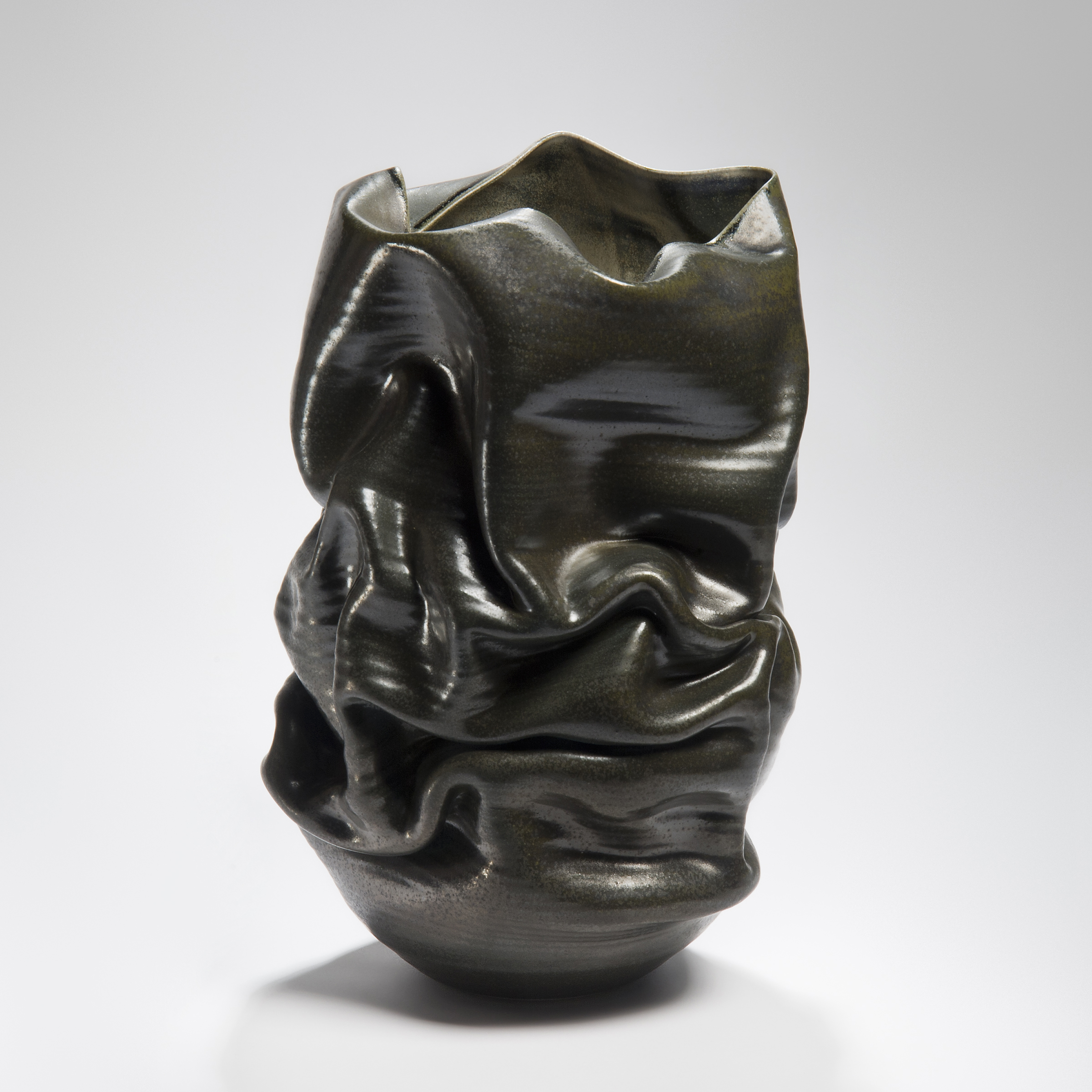 brown leather like crinkled and collapsing handmade ceramic vase