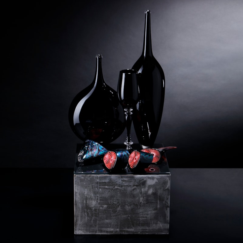black and red contemporary still life art glass sculpture with vases and cut fish