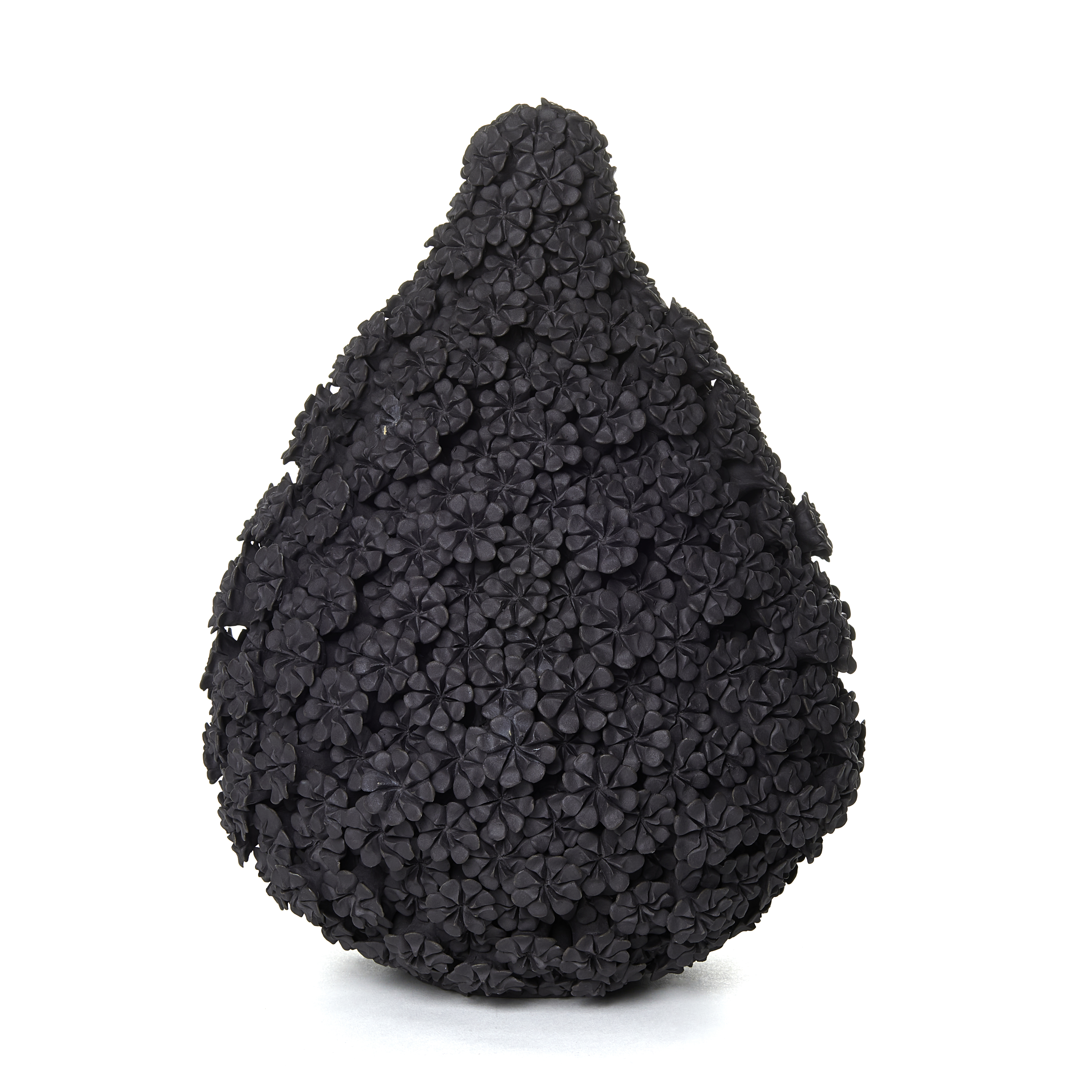 black stoneware teardrop shaped sculpted artwork covered in flowers