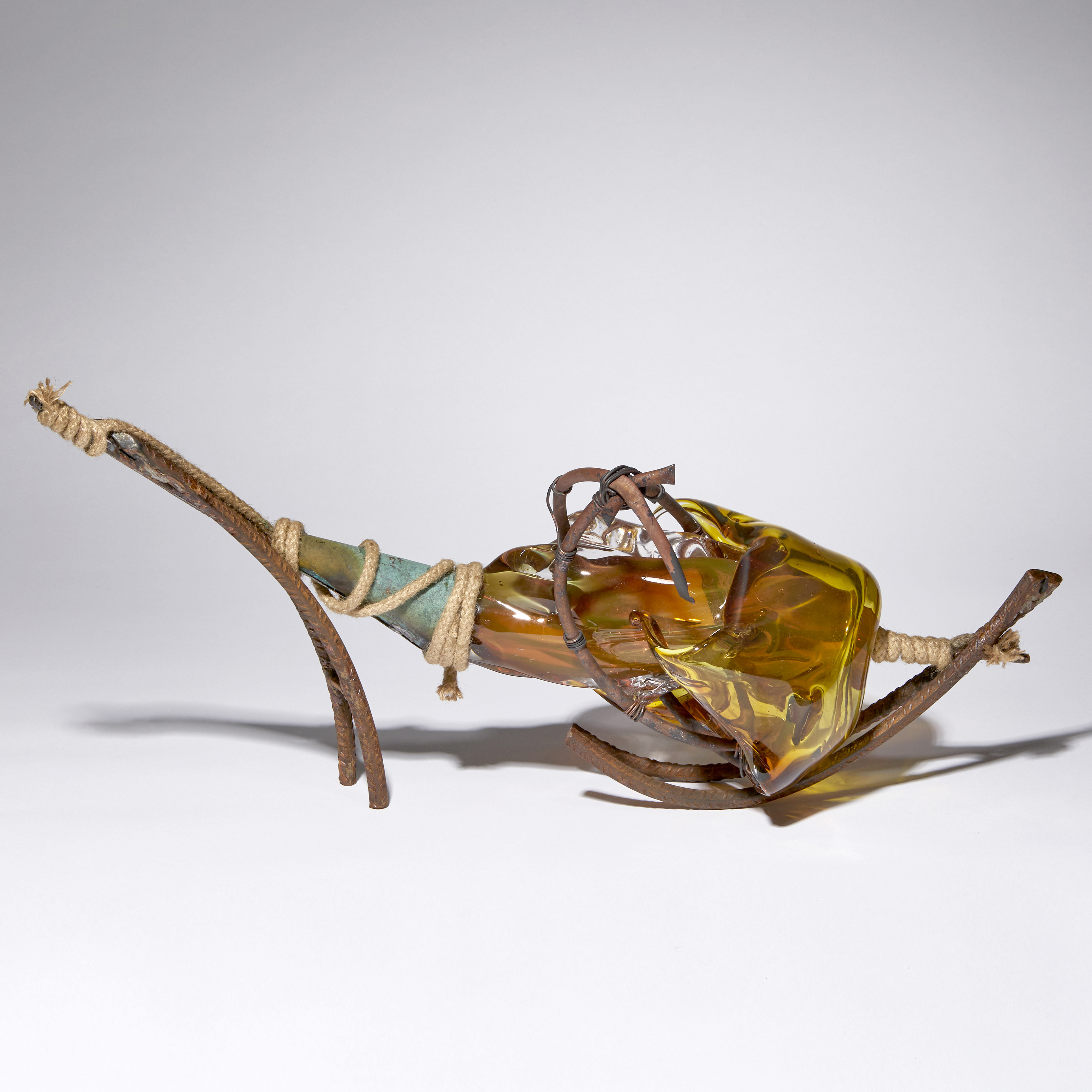 amber and brown contemporary mixed media abstract sculpture made blown glass patinated metal and rope