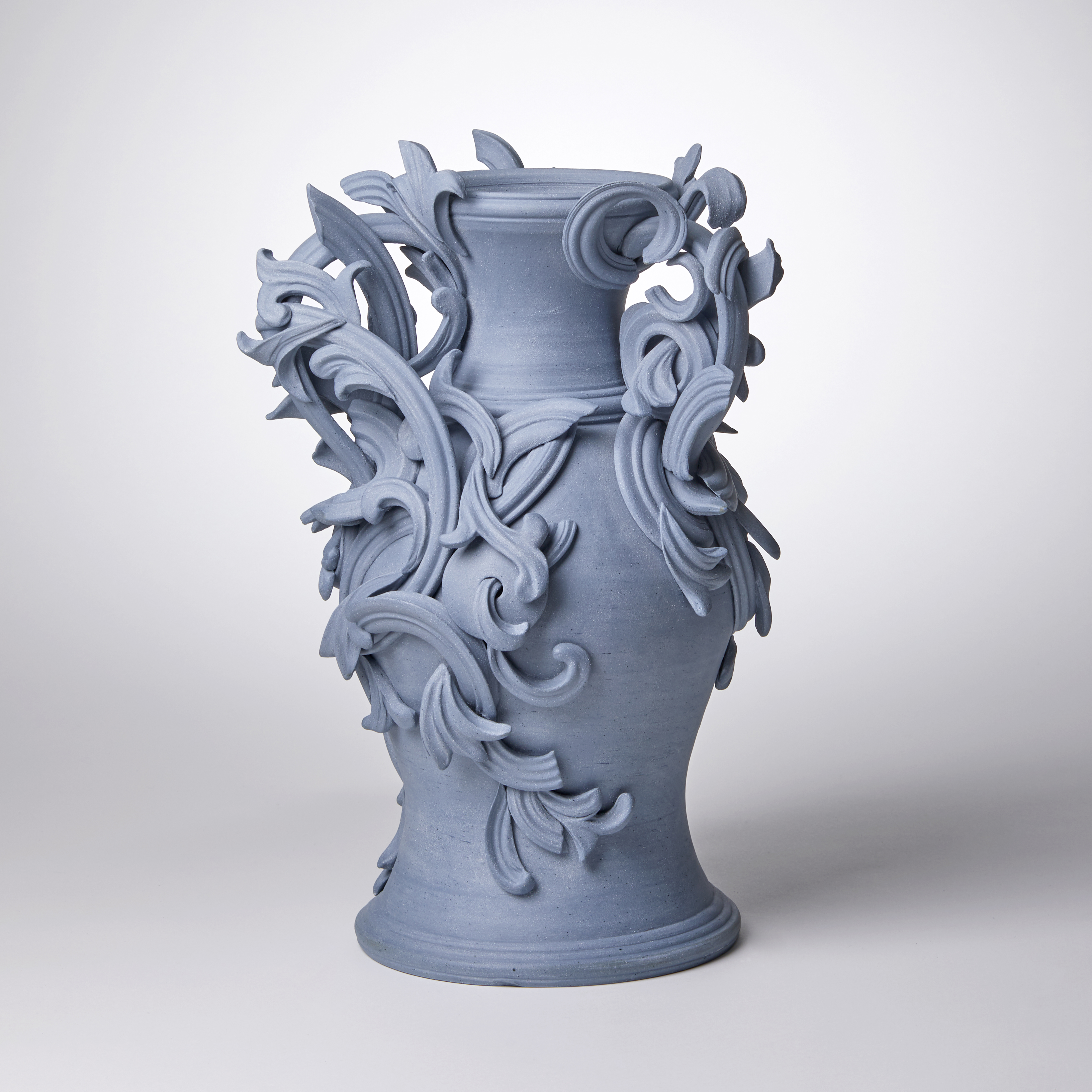 blue ceramic vase with decorative classical trim