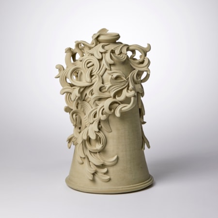 grey decorative stoneware vase sculpture with ornate floral trim