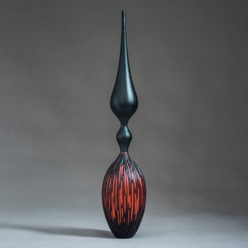 red and black contemporary geometrically patterned sculpture made from handblown and cut glass