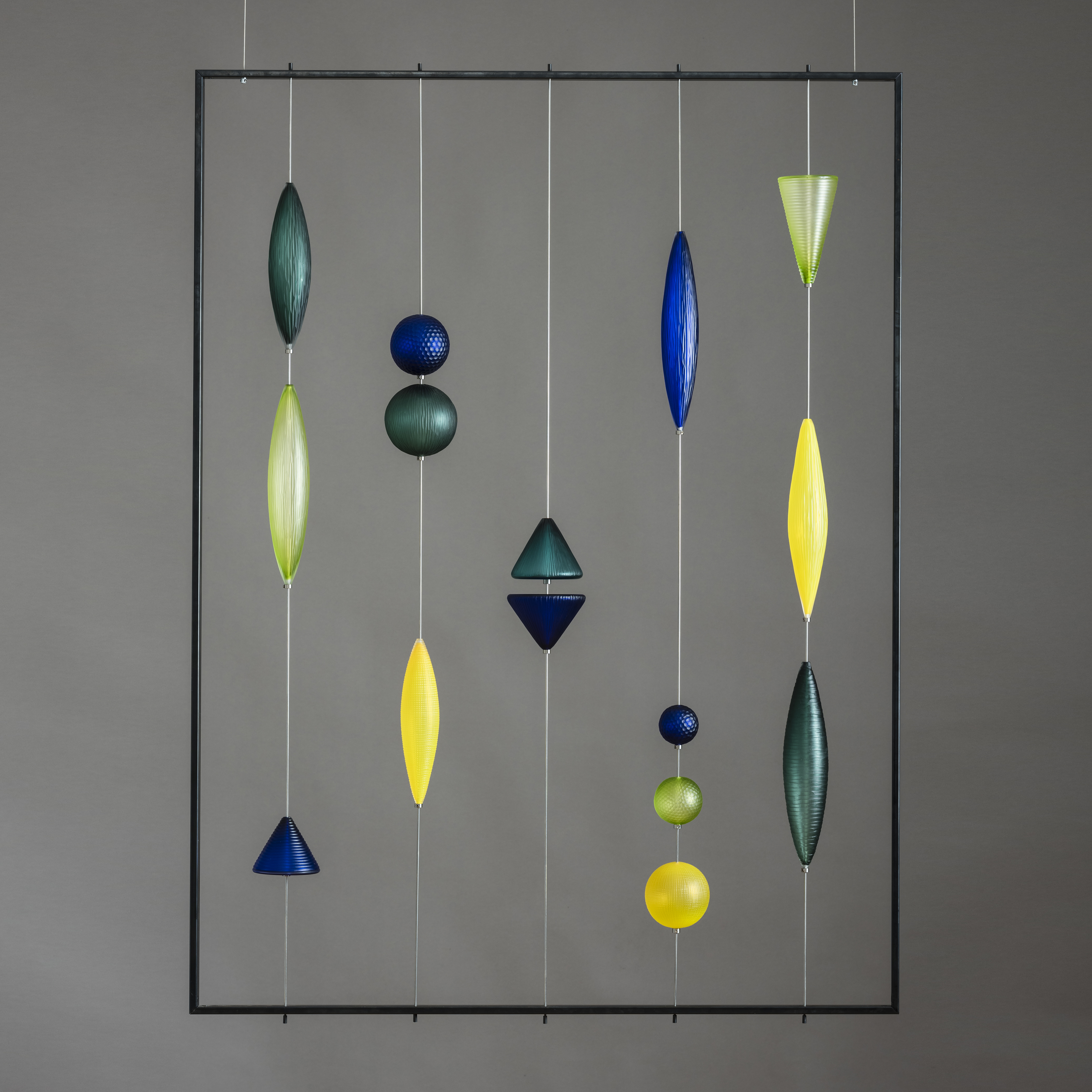 yellow blue and green geometric abacus style hanging sculpture made from handblown and cut glass with steel frame