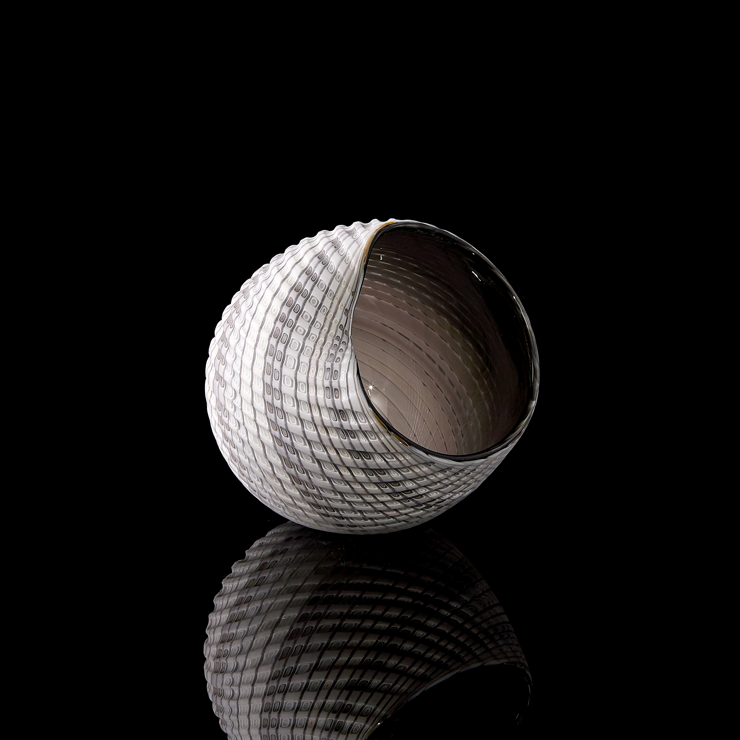 modern handblown and cut glass decorative ornament with geometric pattern