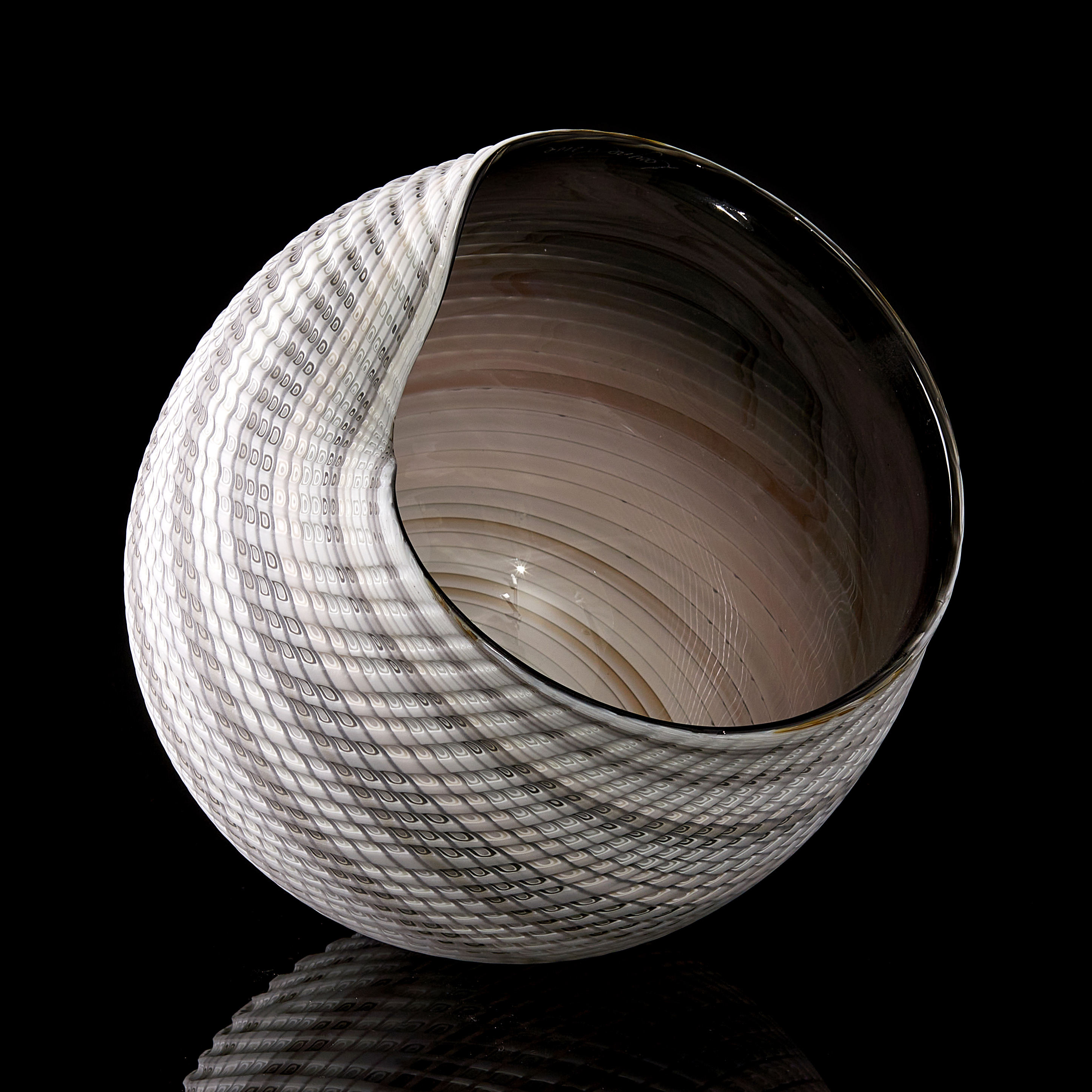 handblown and cut glass contemporary sculpture with swirling pattern 