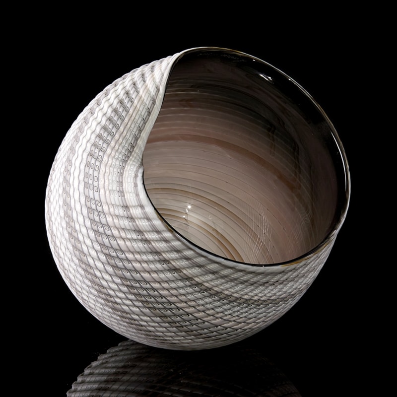 handblown and cut glass contemporary sculpture with swirling pattern