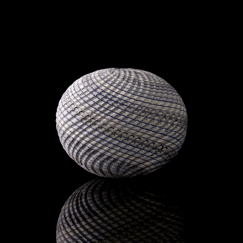 blue grey and white contemporary sculpture with swirling pattern made from handblown and cut glass