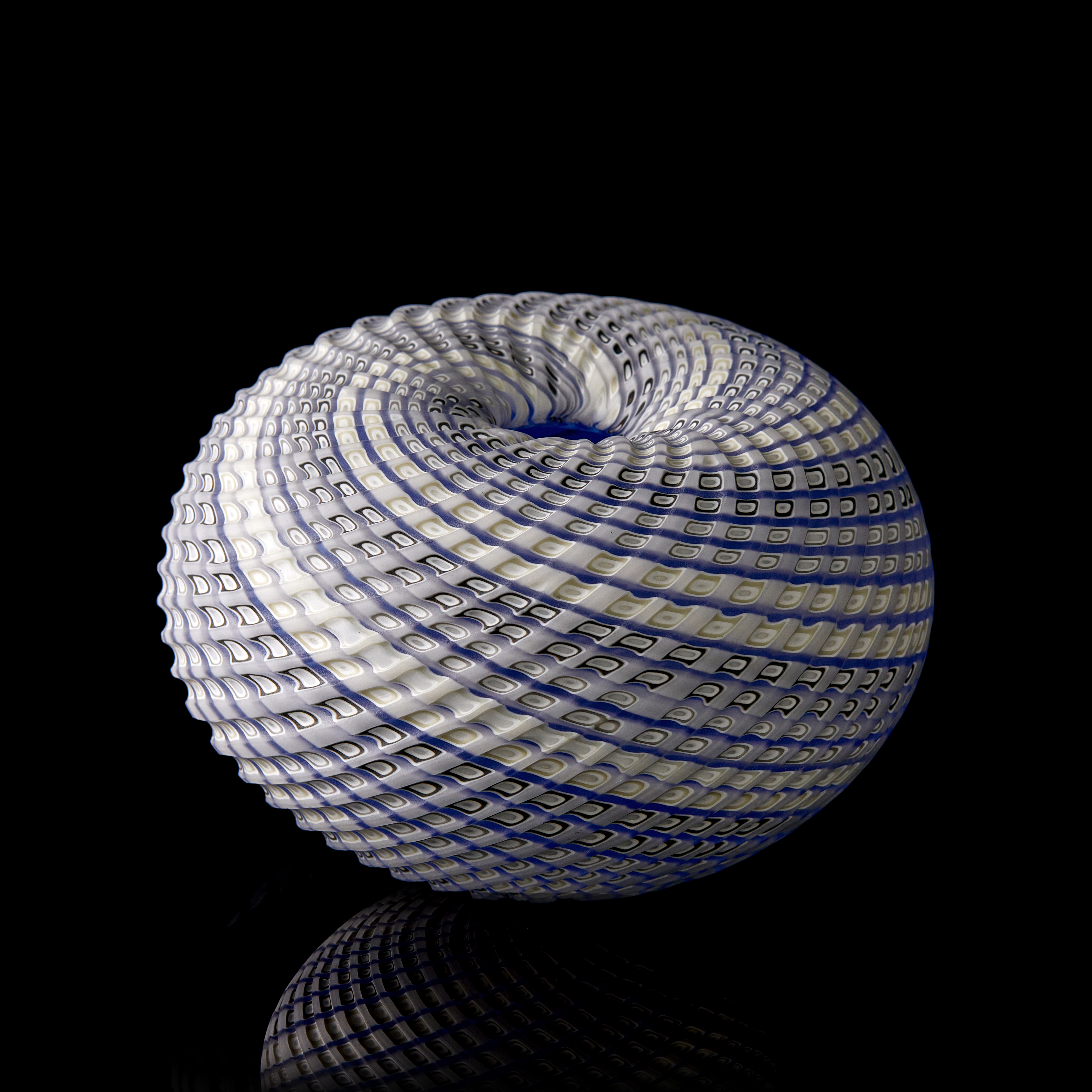 blue grey and white contemporary sculpture with swirling pattern made from handblown and cut glass