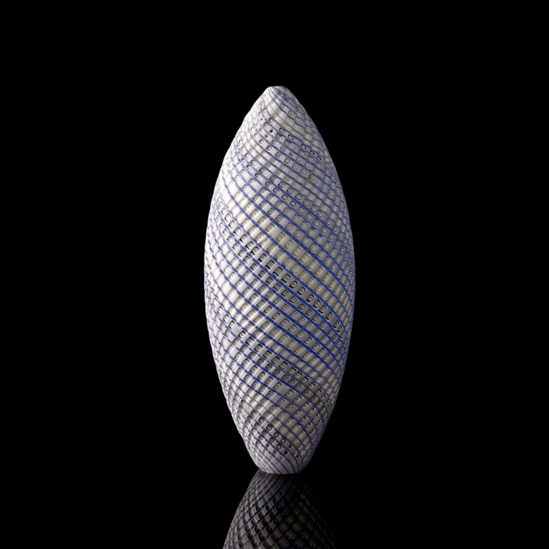blue grey and white contemporary sculpture with swirling pattern made from handblown and cut glass