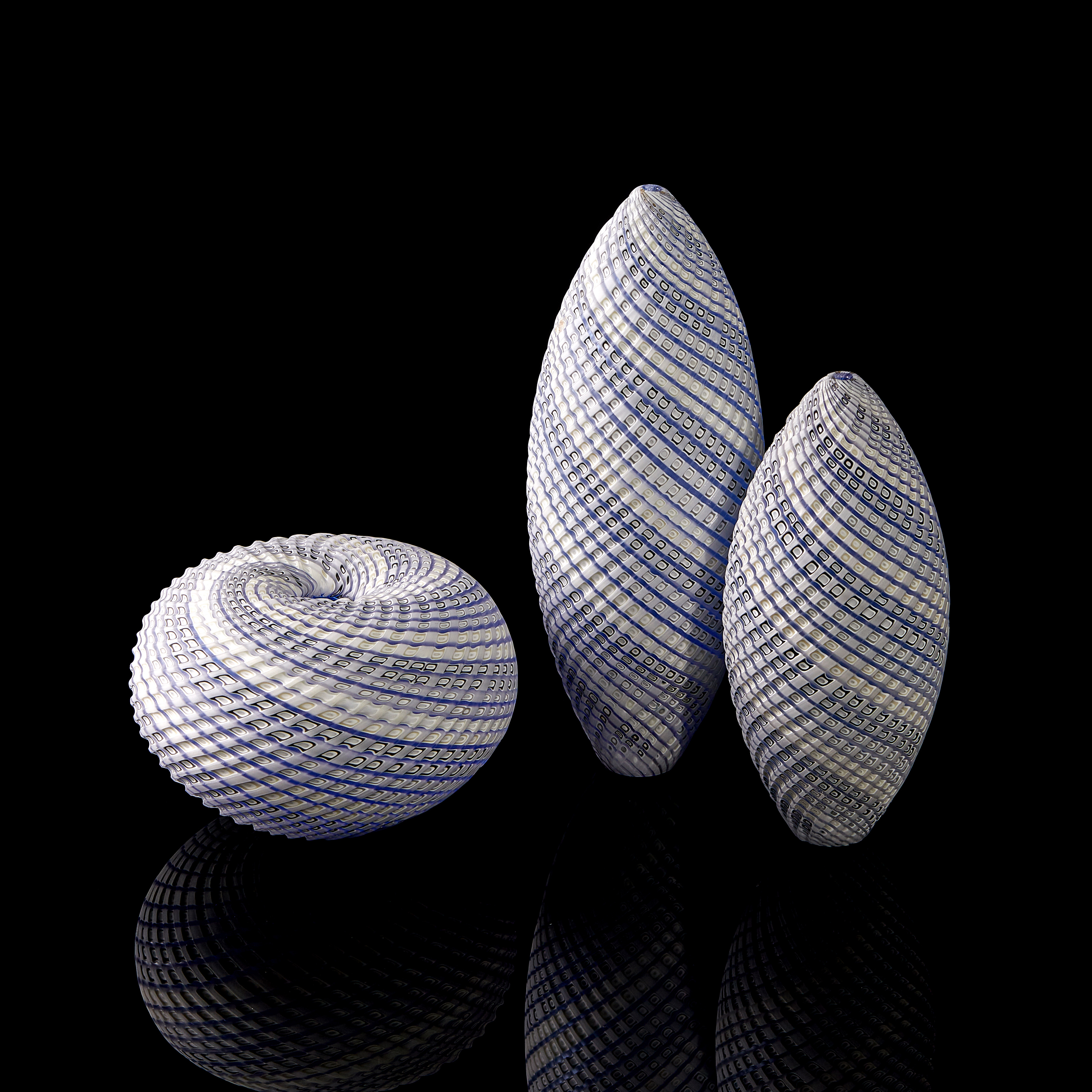 blue grey and white contemporary sculptural installation with swirling pattern made from handblown and cut glass