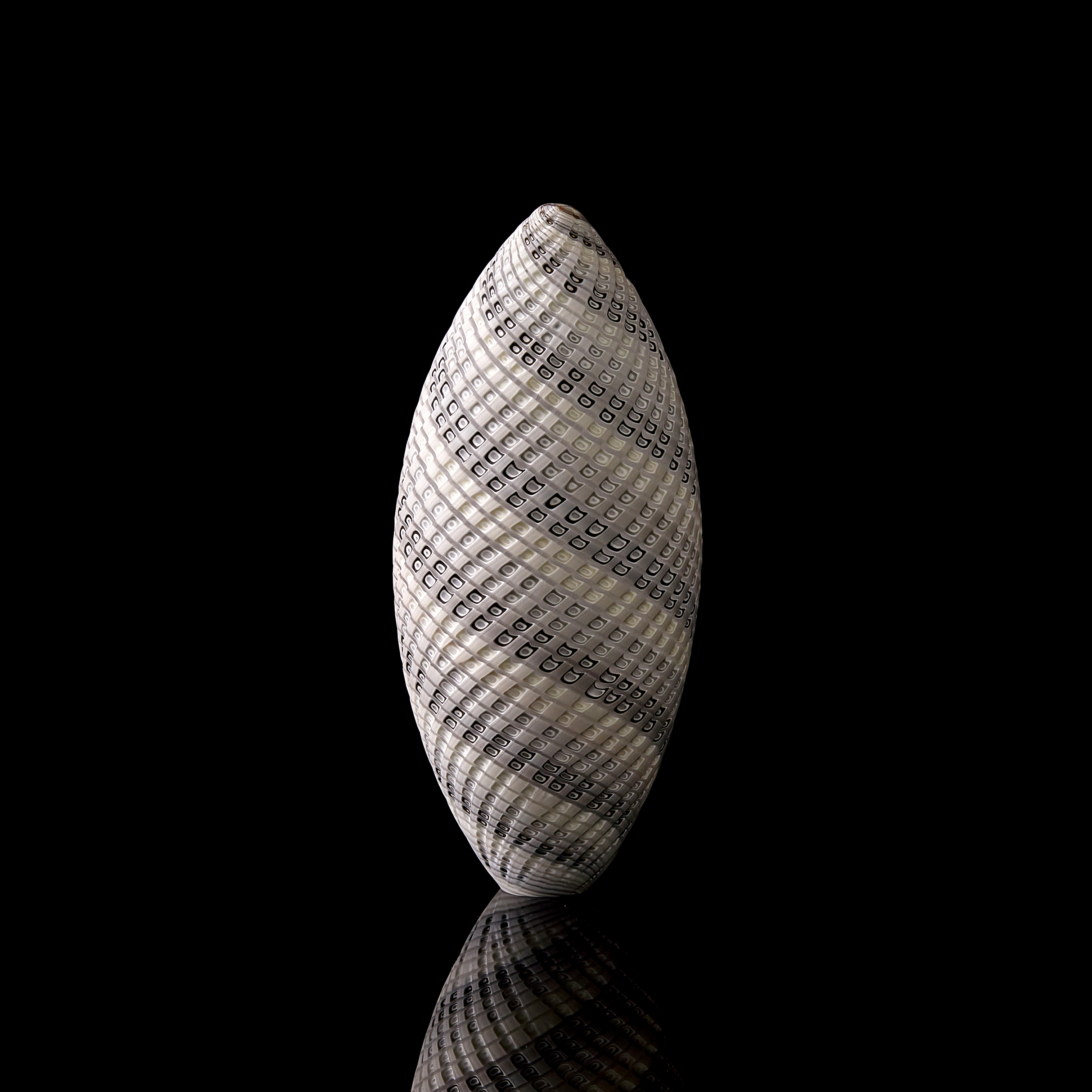 grey and white contemporary sculptural vessel with swirling pattern made from handblown and cut glass