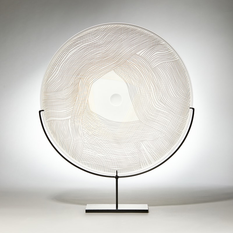 grey gold and clear round sculptural glass plate made from handblown and cut glass with metal stand
