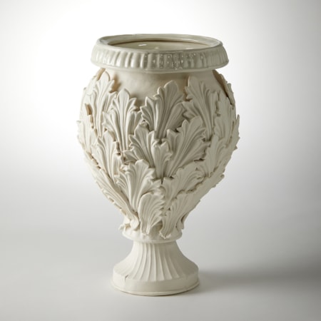 footed ornate vessel with leaf decoration handmade from porcelain