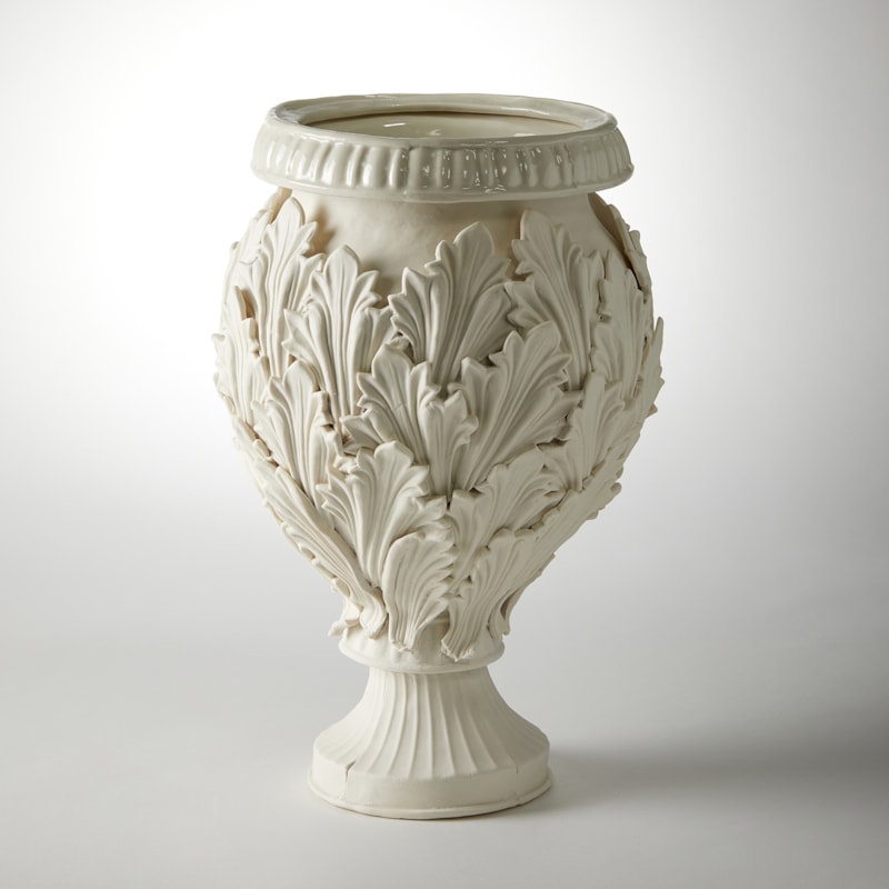 footed ornate vessel with leaf decoration handmade from porcelain