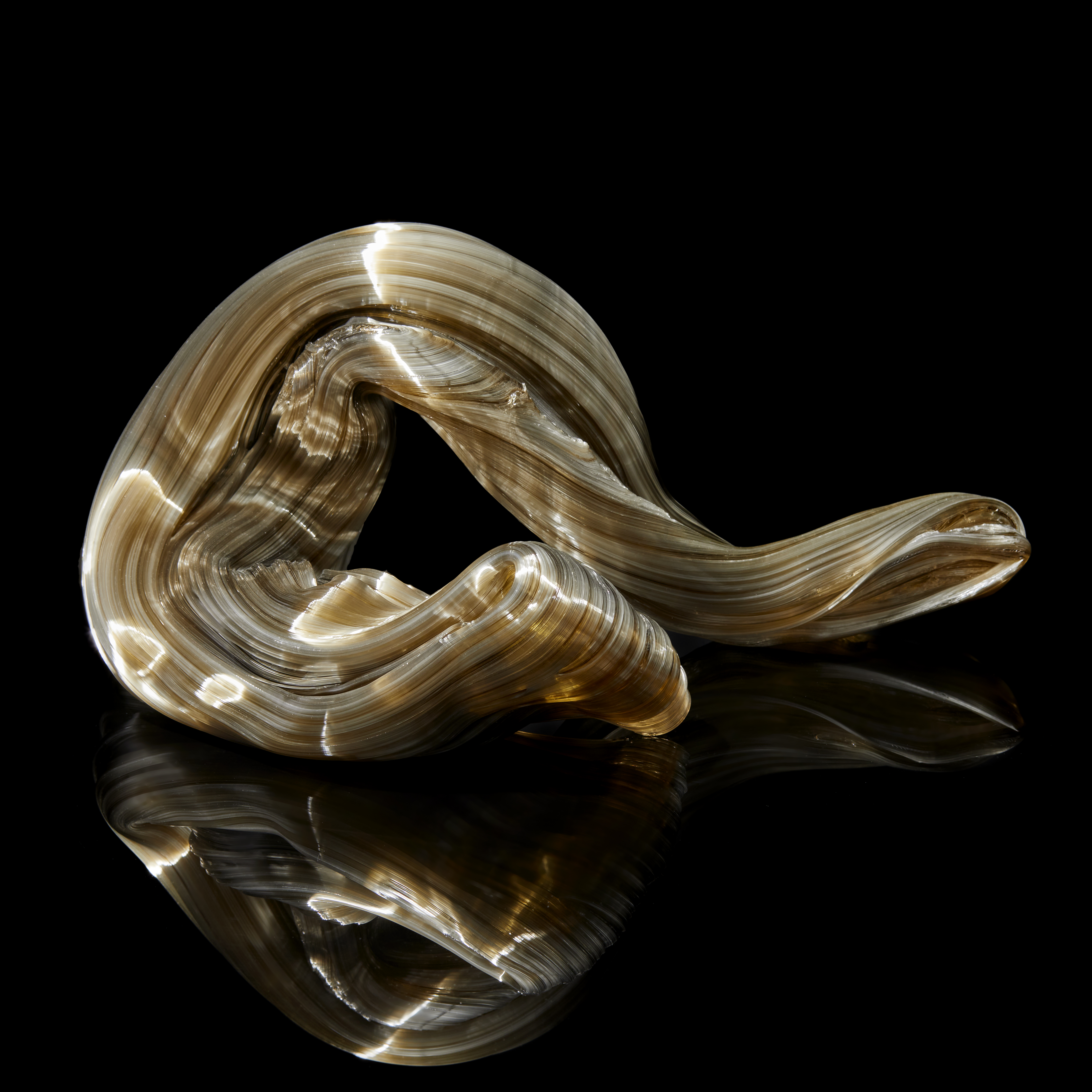 glossy bronze organic ridged twisting candy like sculpture handmade from glass