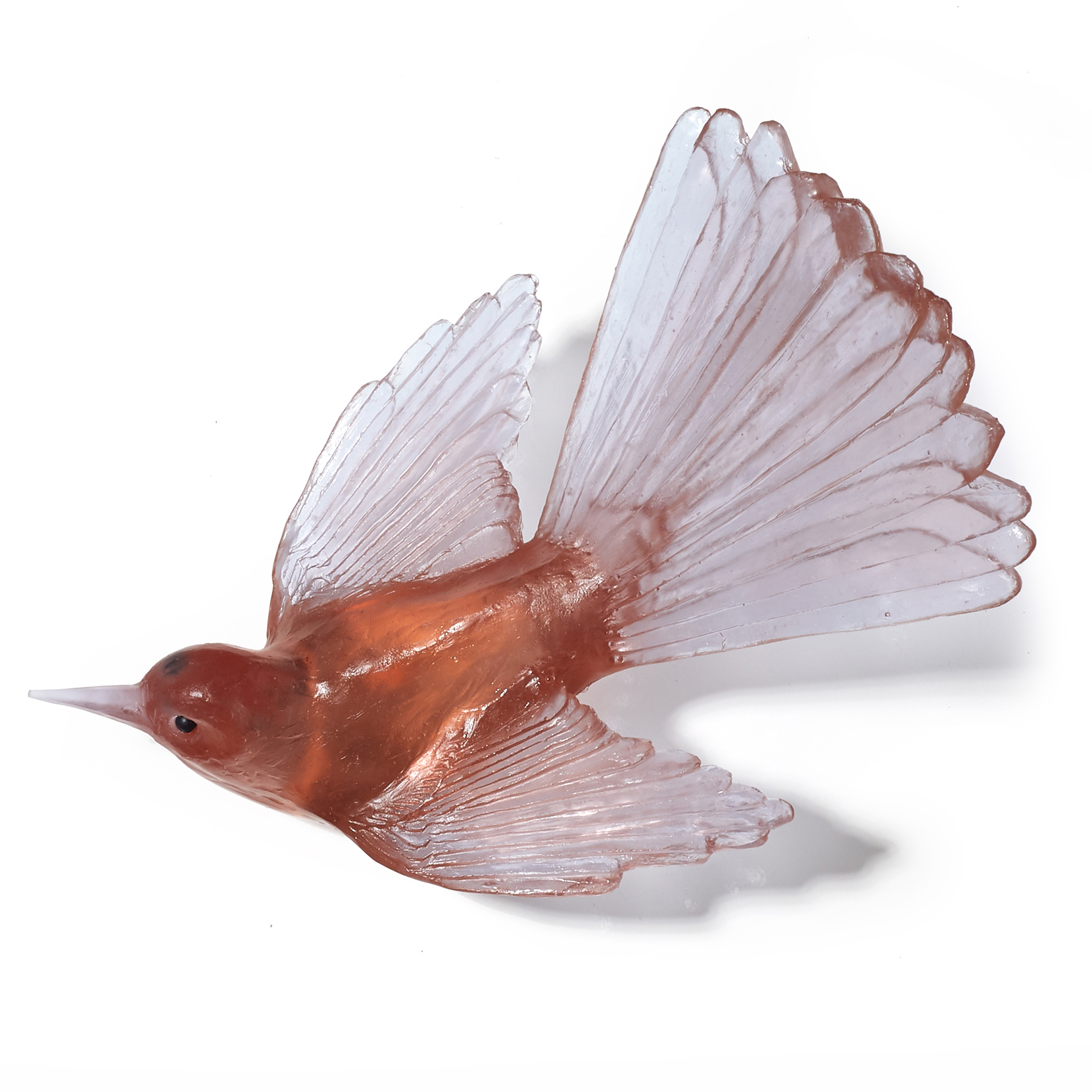 art glass sculpture of fan tail bird in light and dark pinky peach
