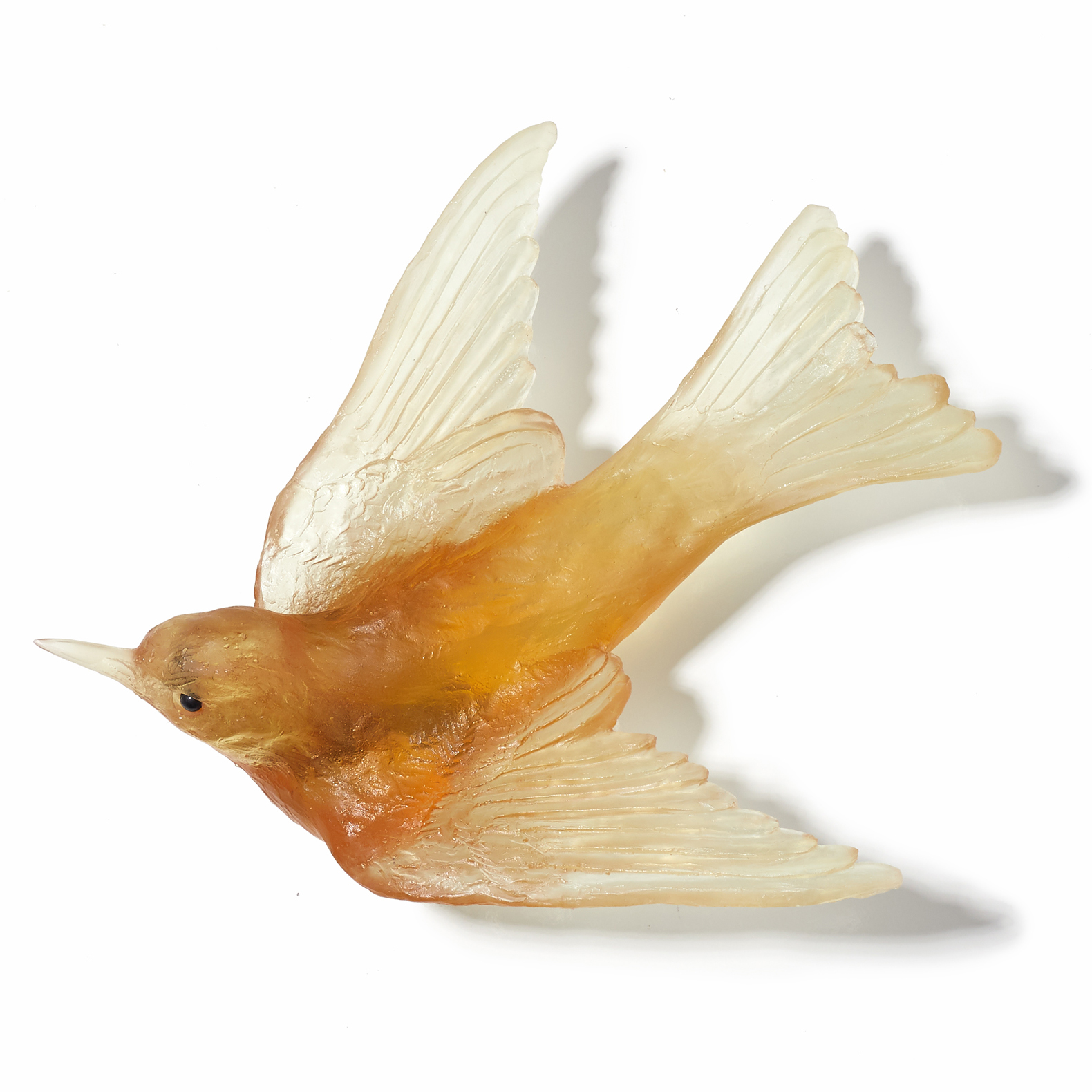 glass sculpture of swallow bird in yellow gold