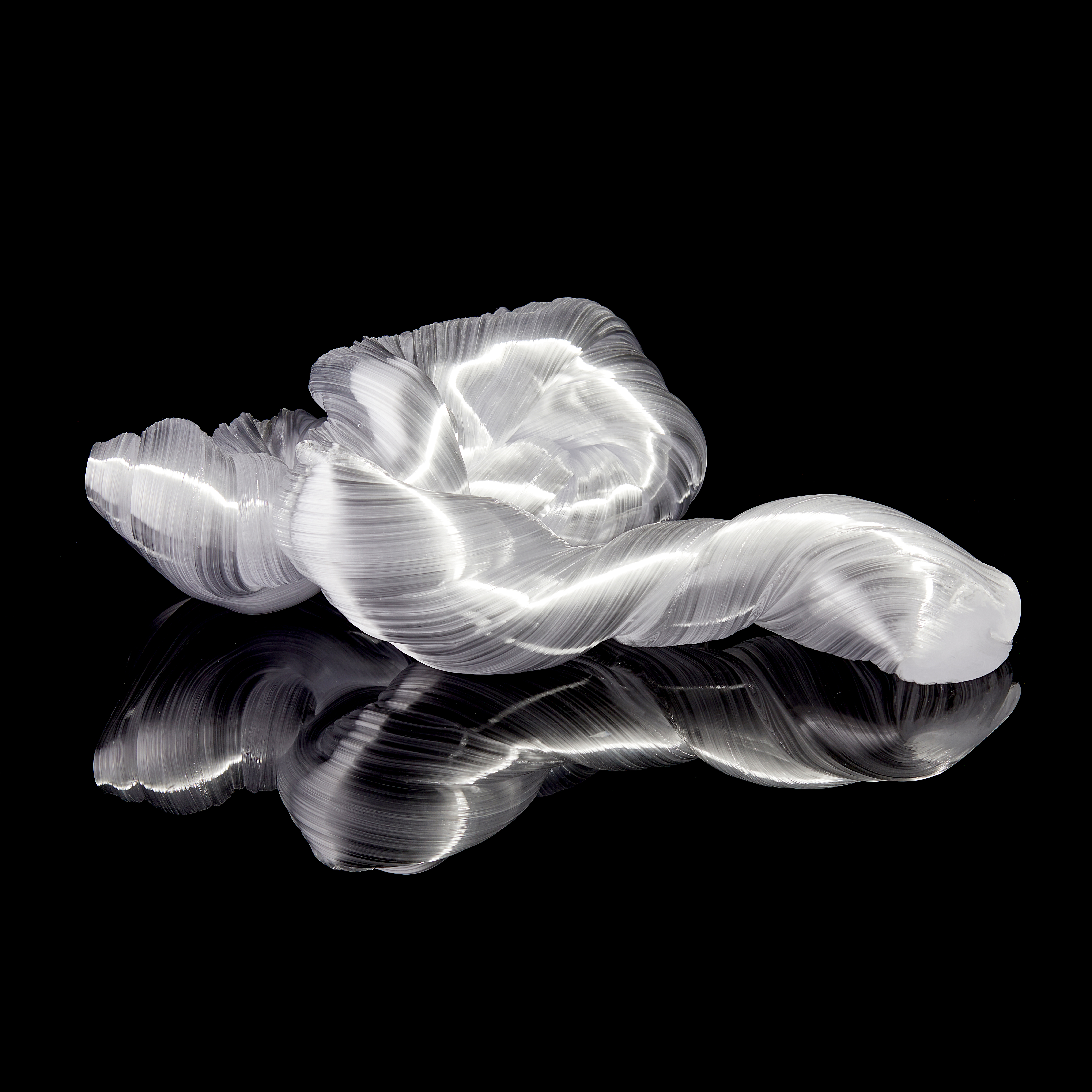 glossy white organic ridged twisting candy like sculpture handmade from glass
