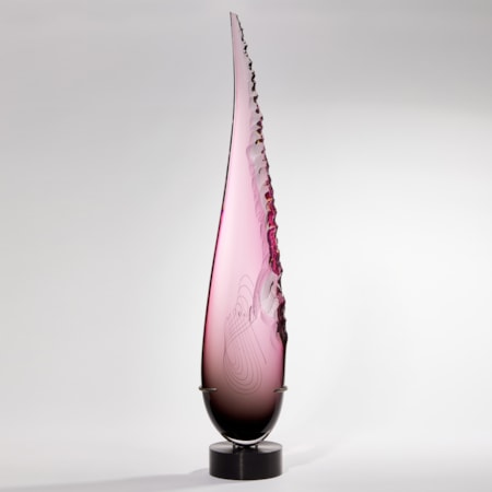 Long teardrop form in pink with one soft edge and chipped detail on the other handmade from glass