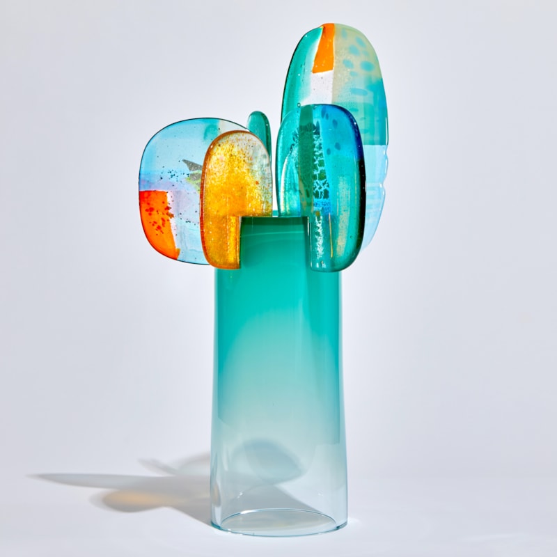 turquoise blue and orange simplified cartoon tree sculpture handmade from glass