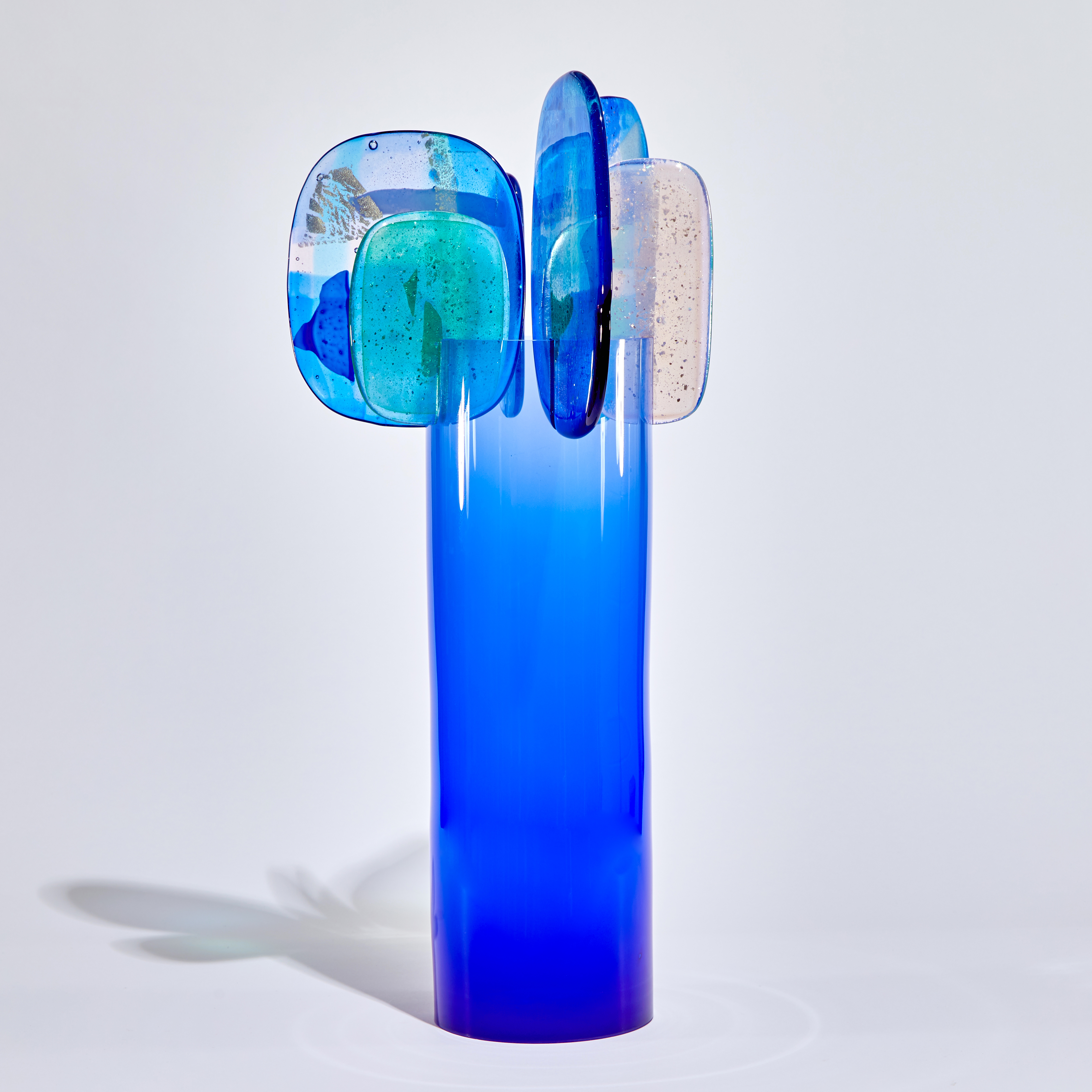 bright blue and pink abstract lollipop style sculpture handmade from glass