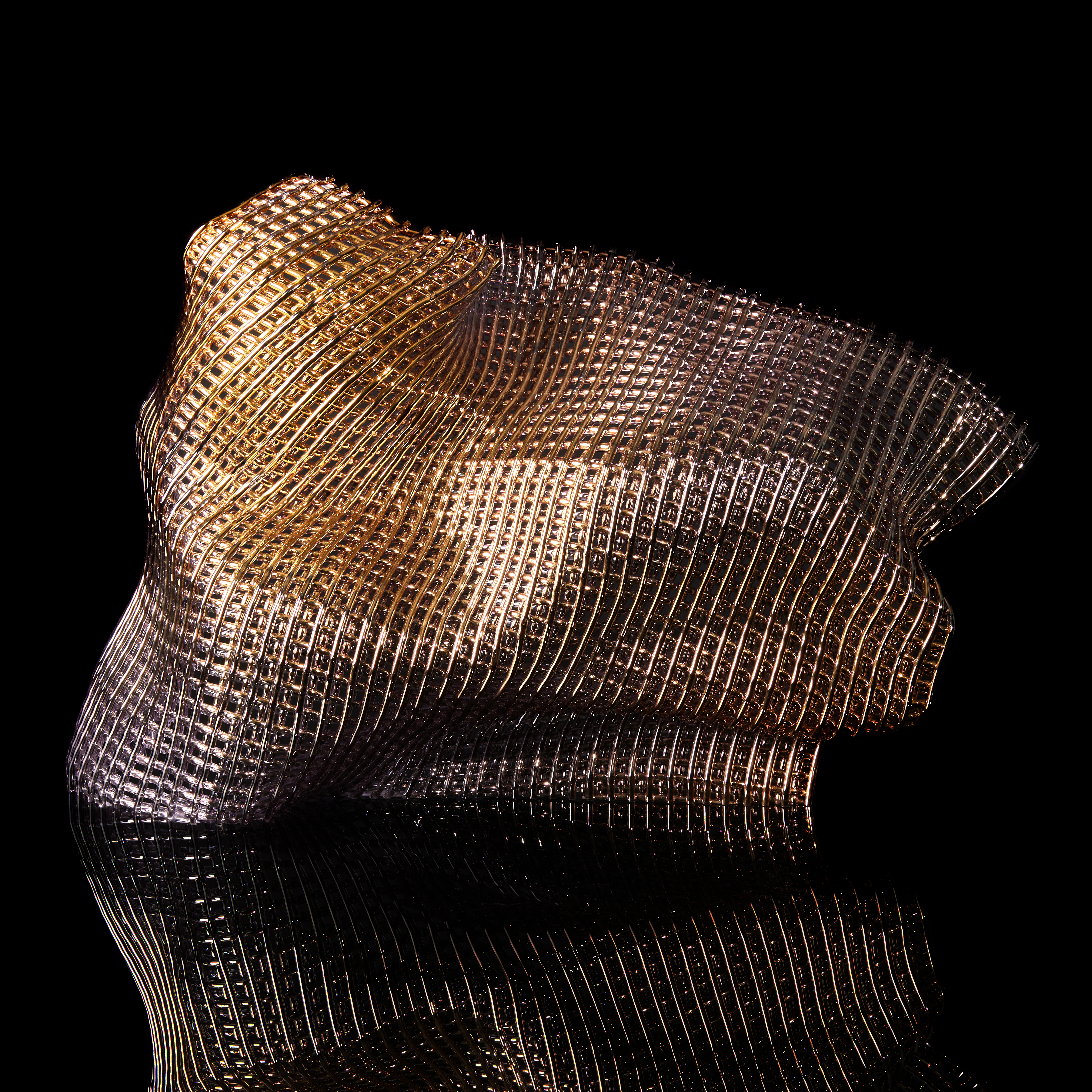 standing woven soft form with gold appearance handmade from canes of glass