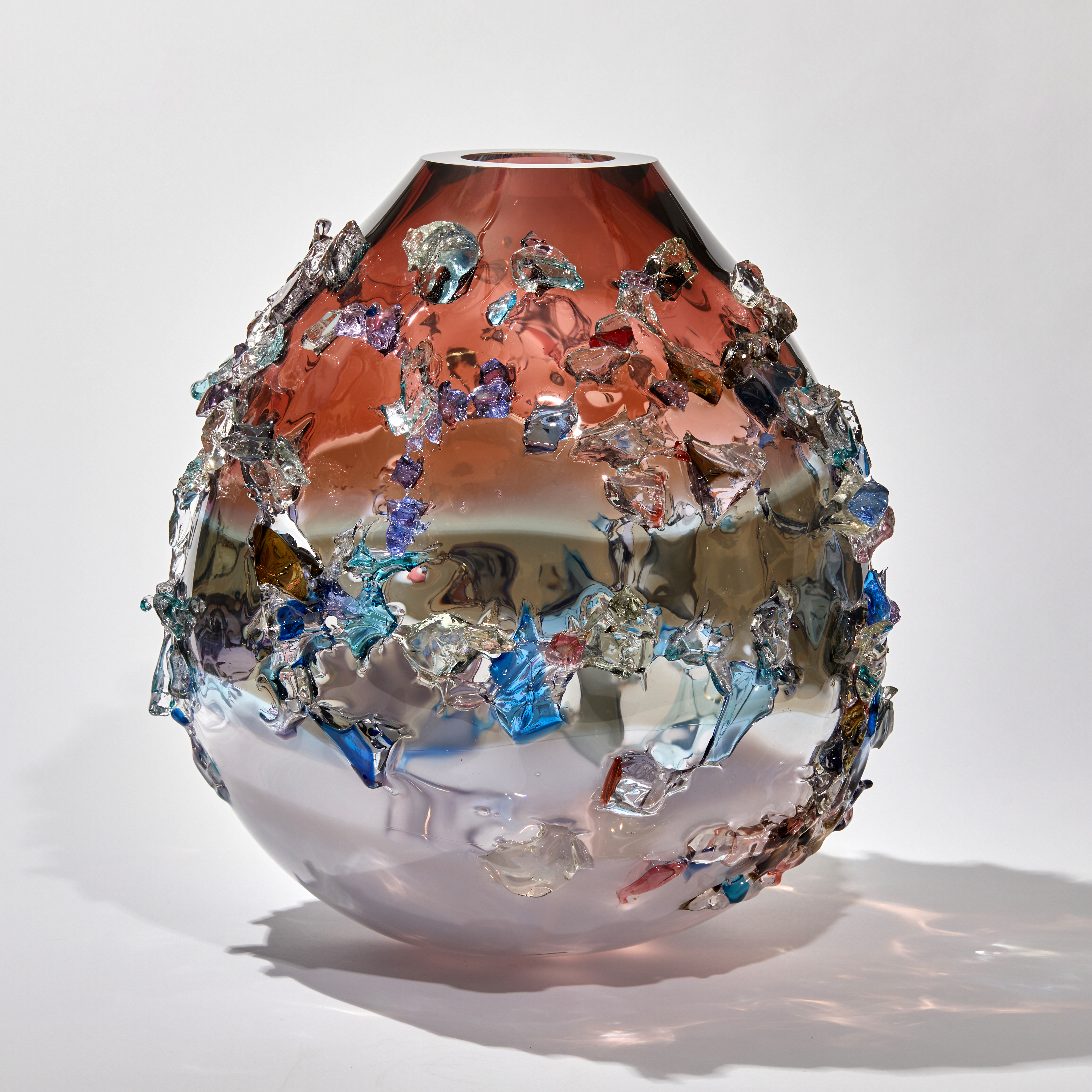 Pink grey and lilac teardrop shaped vase covered in a multicoloured soft glass shards handmade from glass