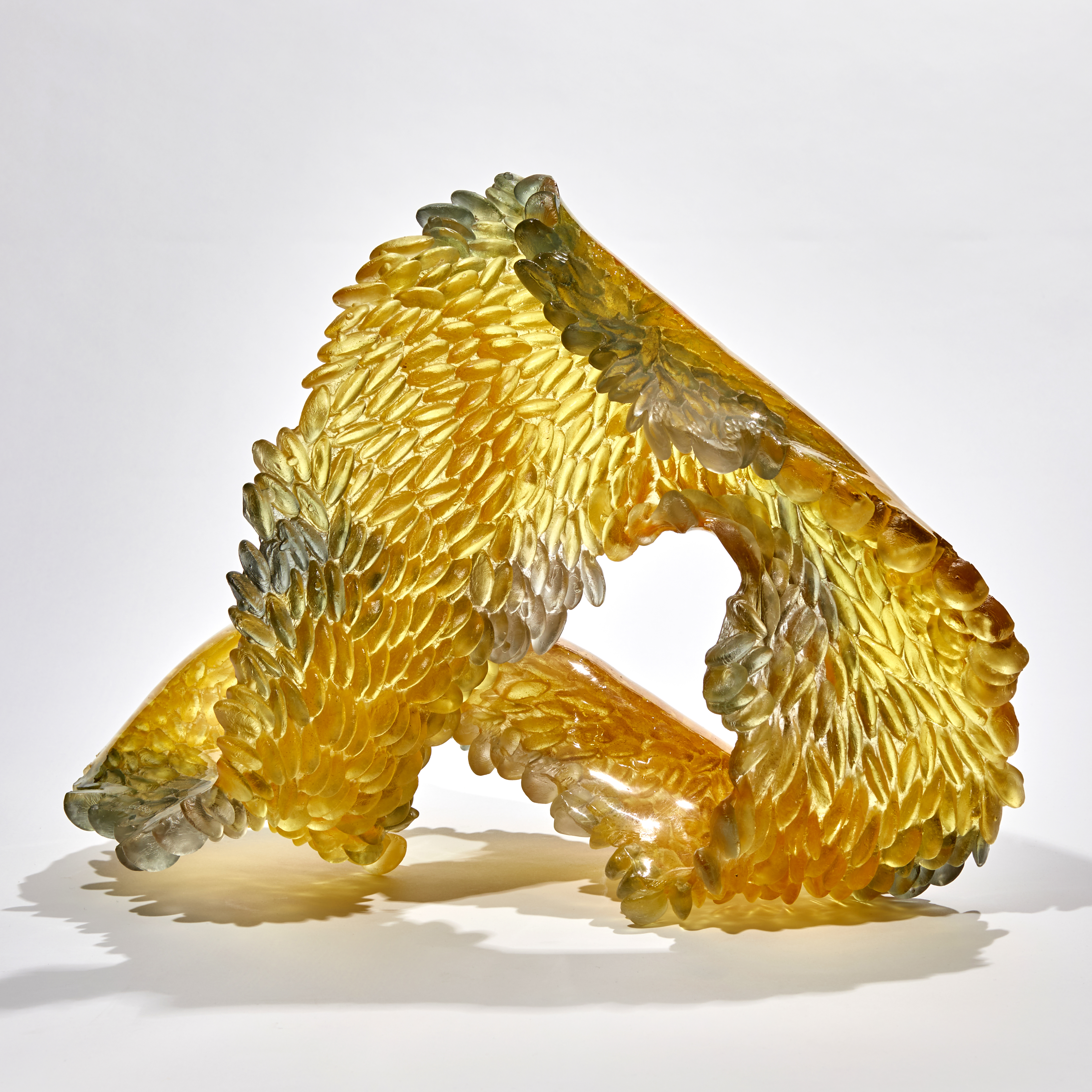 yellow and grey twisted loop formed textural sculpture handmade from cast glass