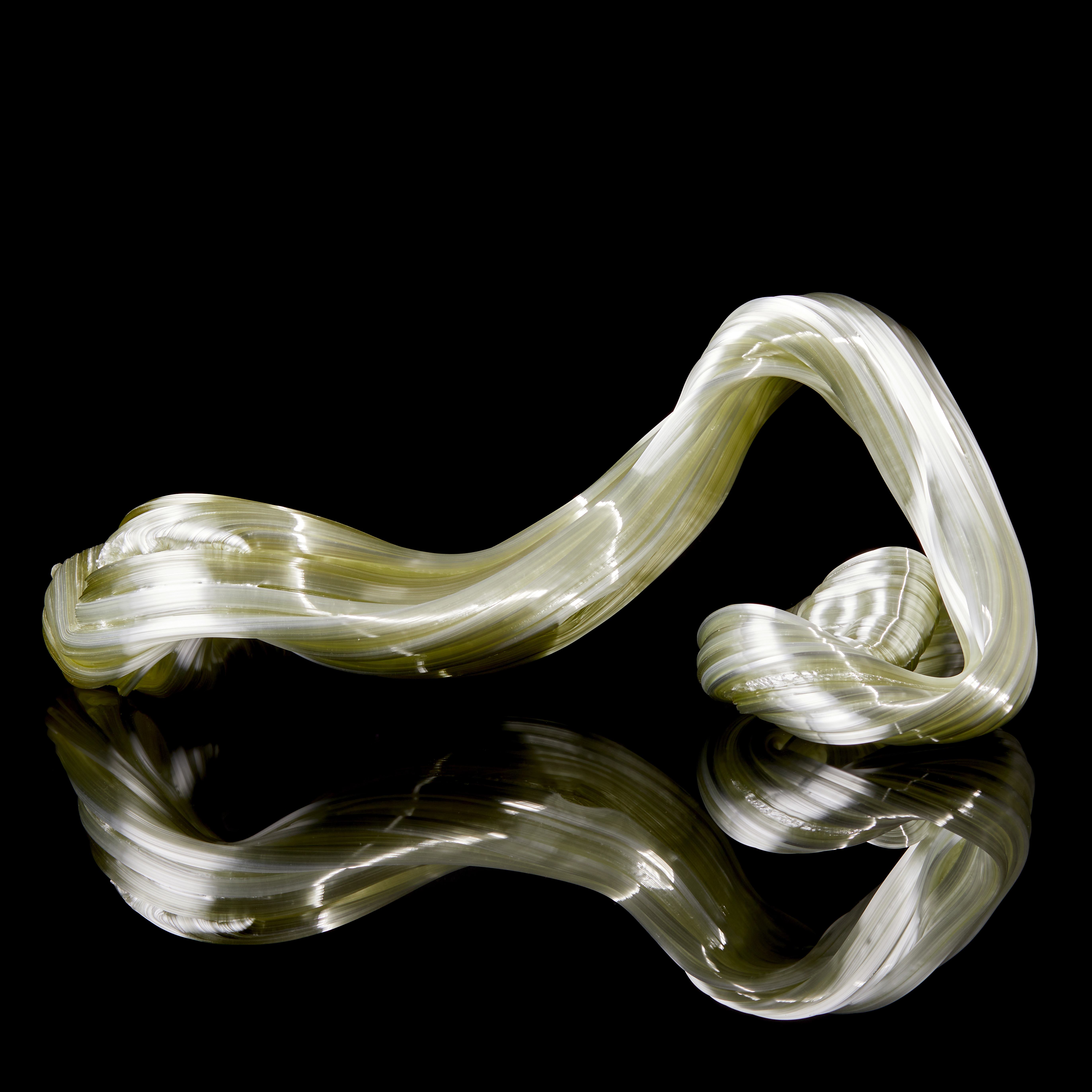 glossy light green organic ridged twisting candy like sculpture handmade from glass