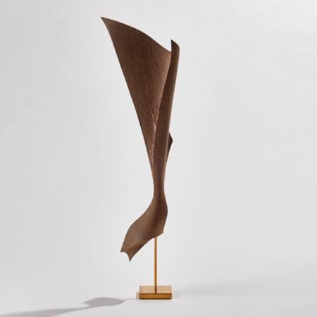 hanging cloth like form with gold detail and gold stand made from wood