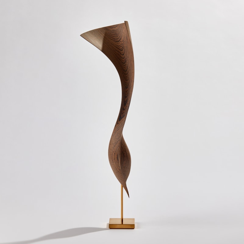 wave like form in wood on gold base handmade with gold detail