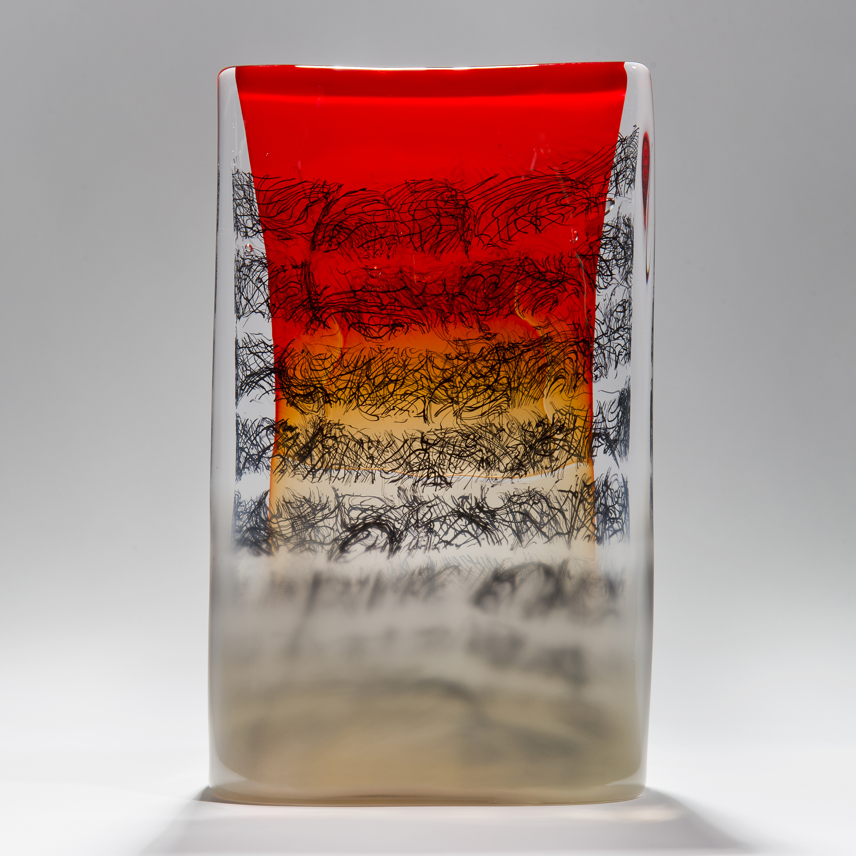 red black clear and taupe rectangular solid glass manuscript tablet sculpture with erratic scribbled black lines