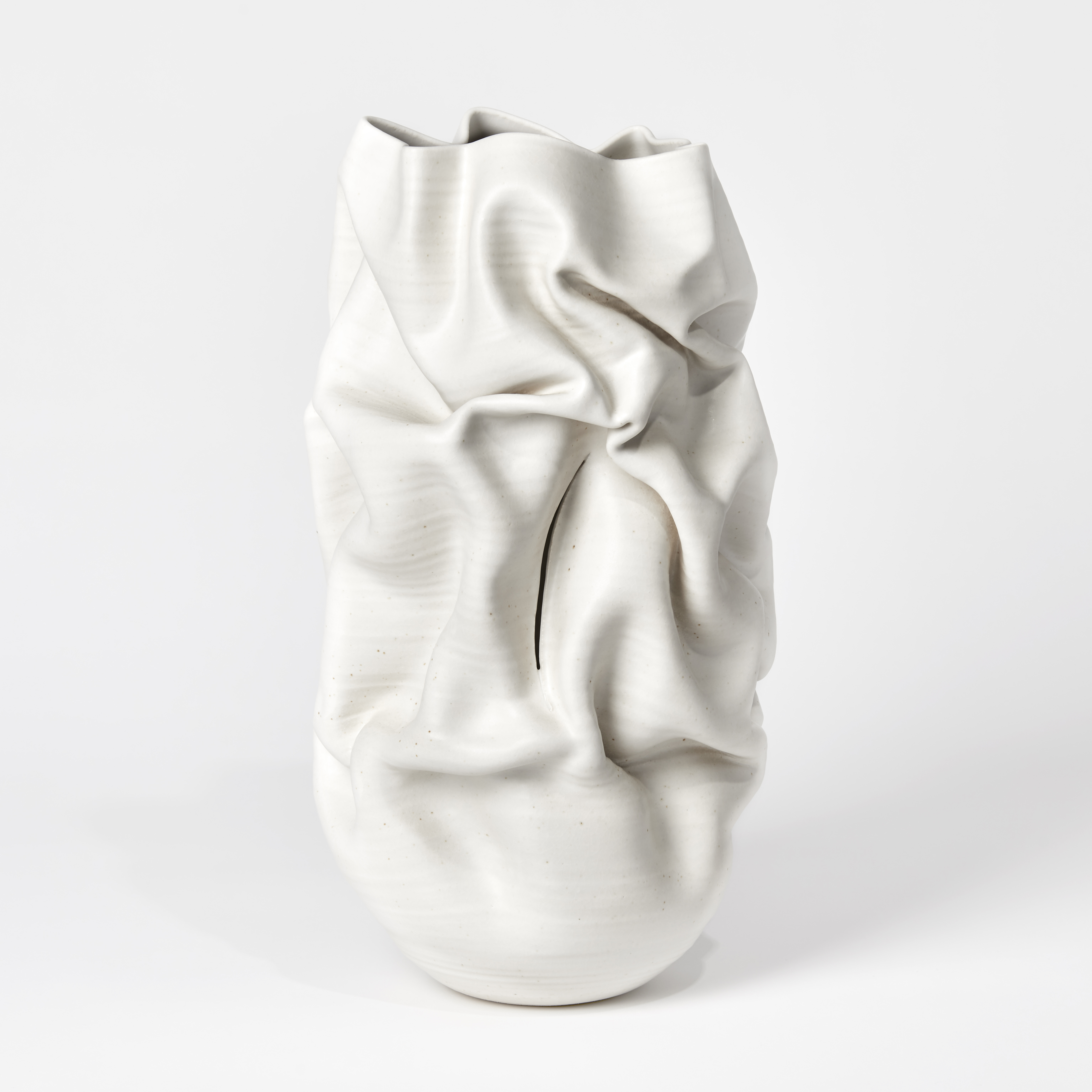 cream crumpled tall vessel with slash handmade from clay