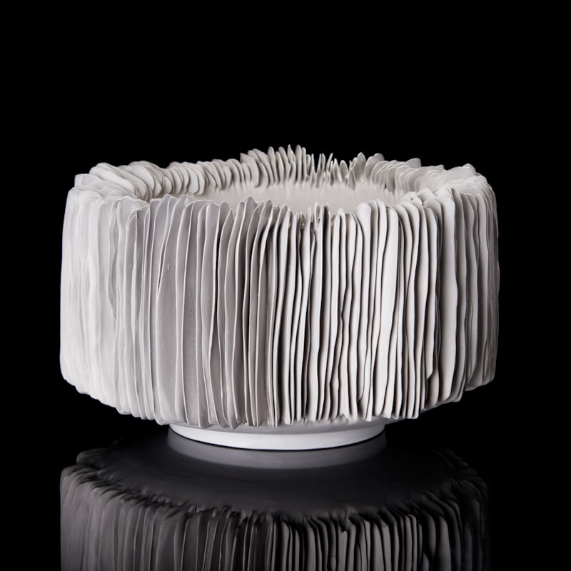 grey round straight sided handmade porcelain footed bowl with ridged covered exterior