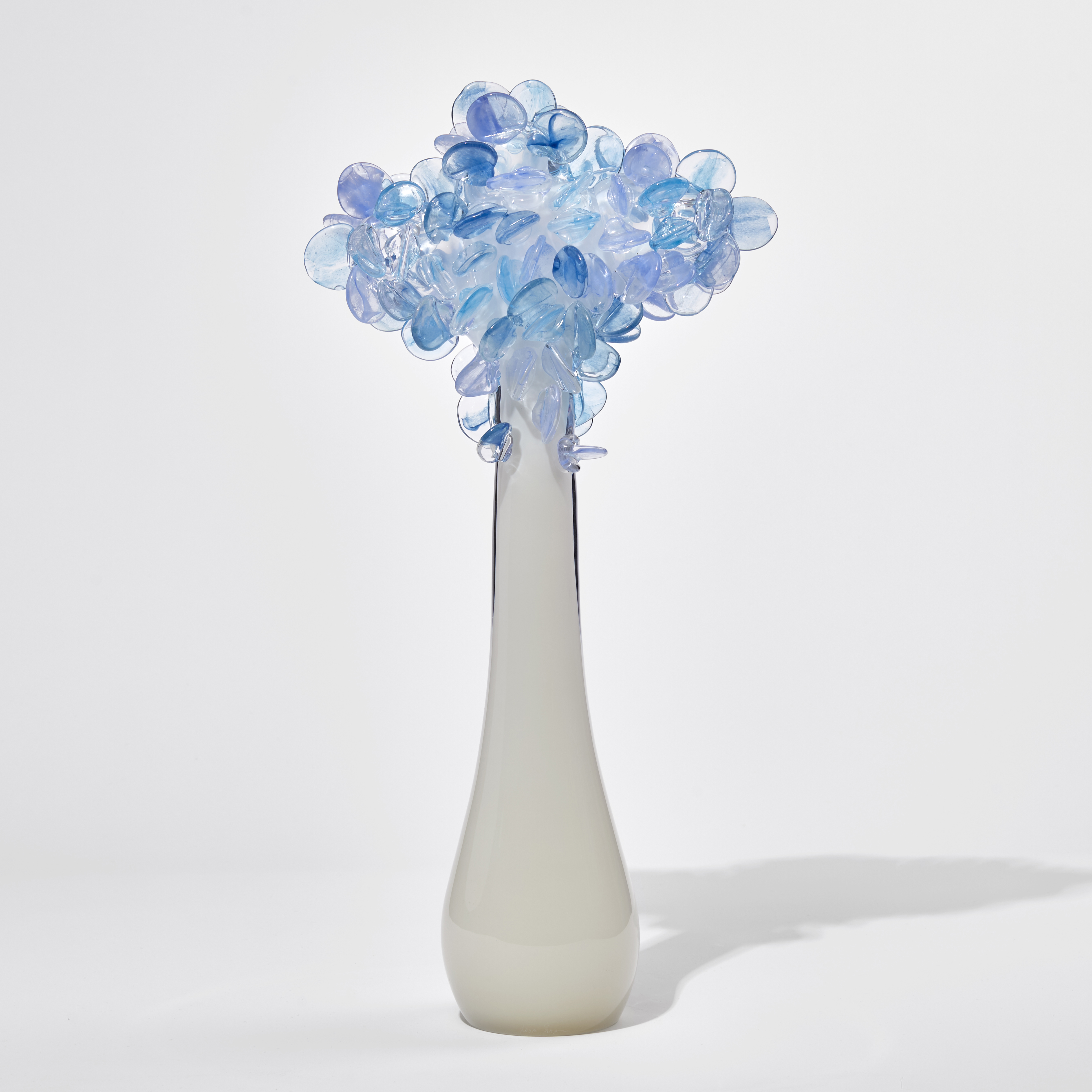 art glass sculpture of flowers in blue and pink