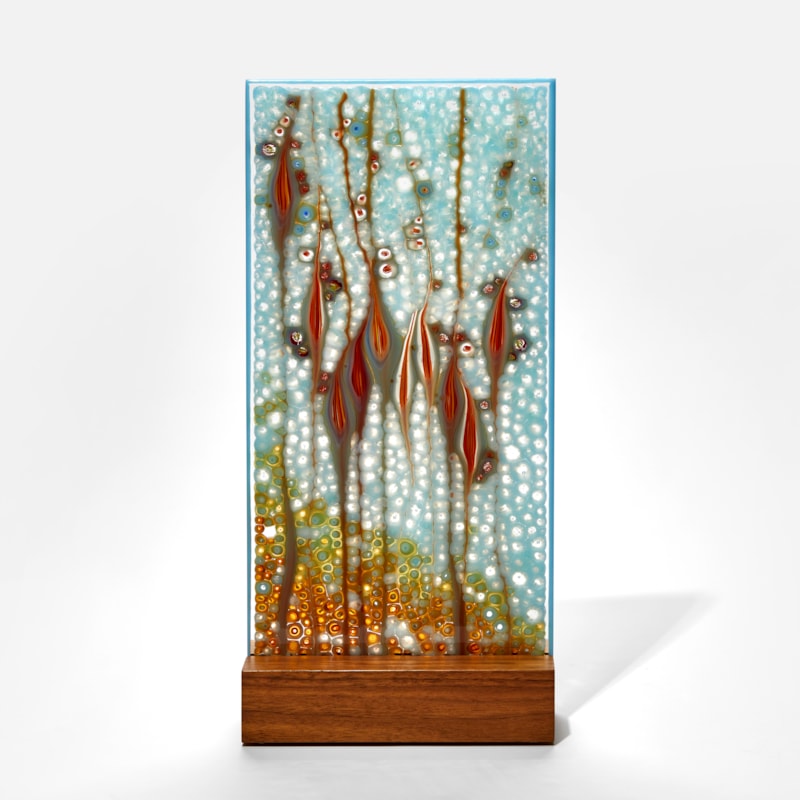 soft aqua blue and red panel handmade from glass with intense organic pattern and wooden base