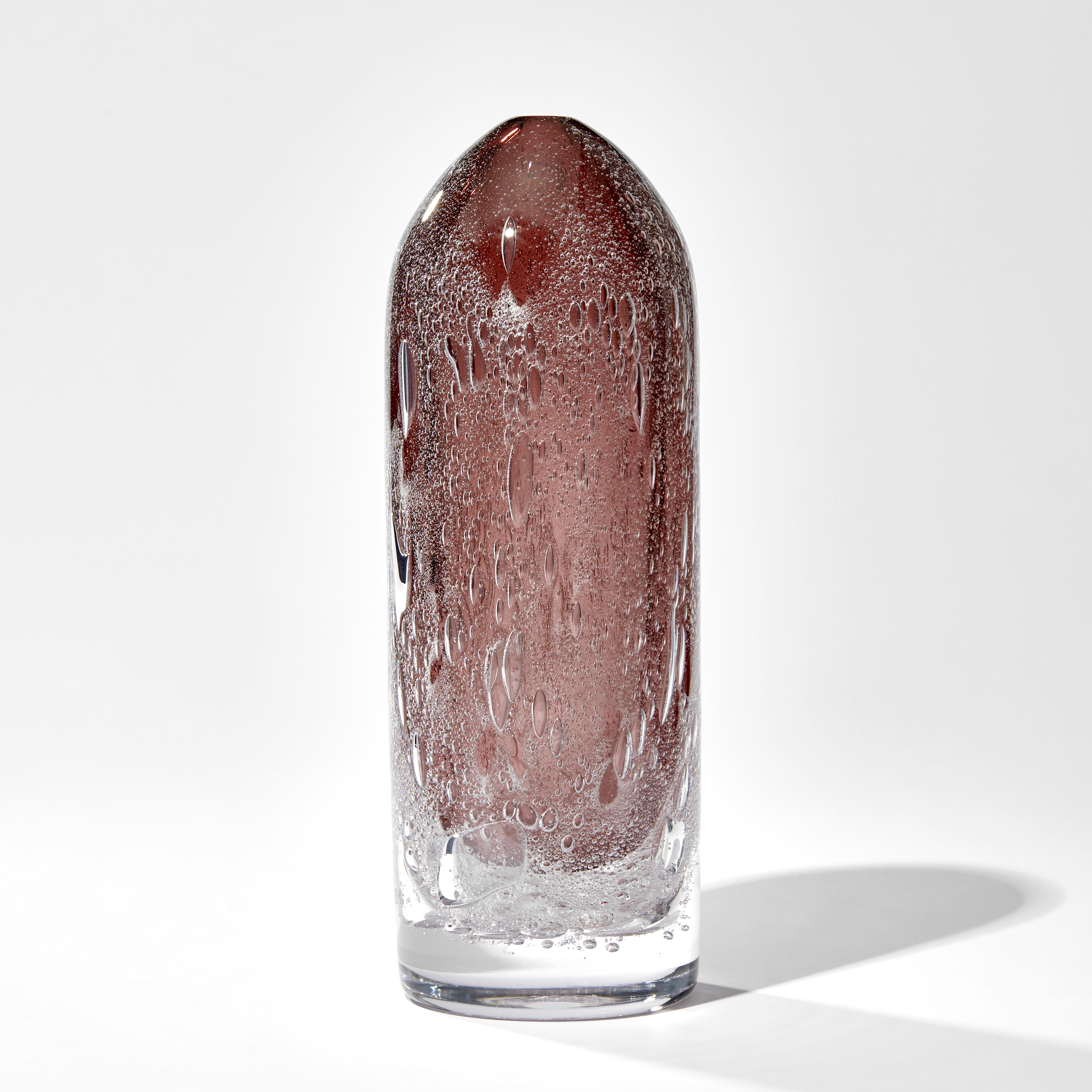 tall rounded top sculpture in aubergine with trapped effervescent bubbles hand made from glass