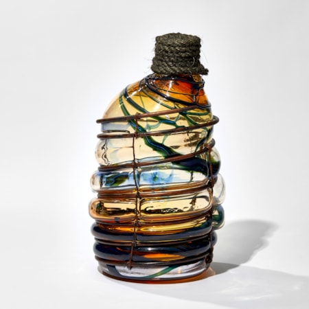 amber blue and red wonky hand made large glass bottle blown in a copper cage with rope bung