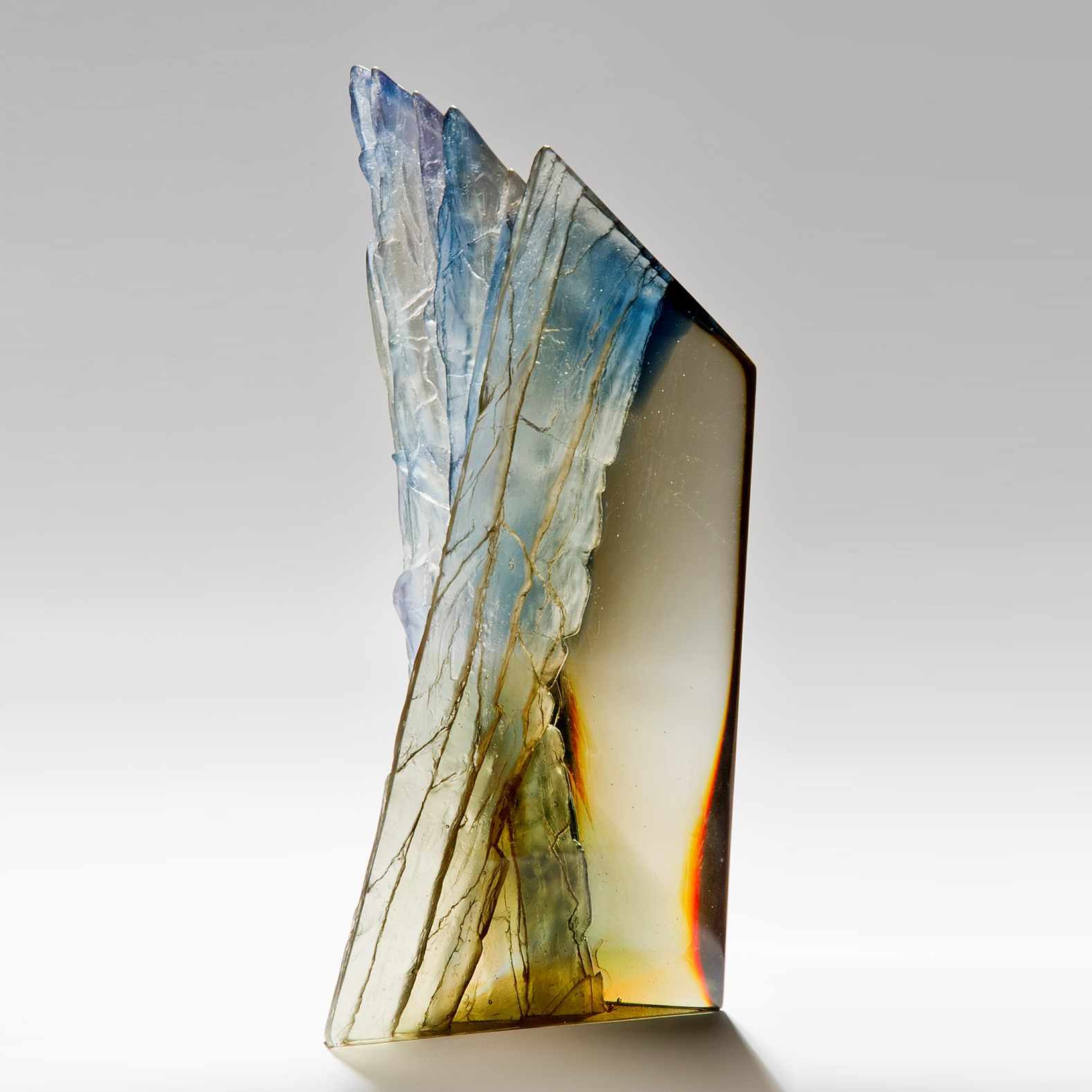 contemporary cast glass centrepiece of cliff edge in browns blues and greys