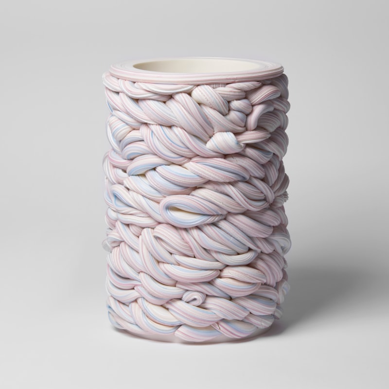 handmade cylindrical shaped vessel created from woven striped tubes of clay in white purple and blue