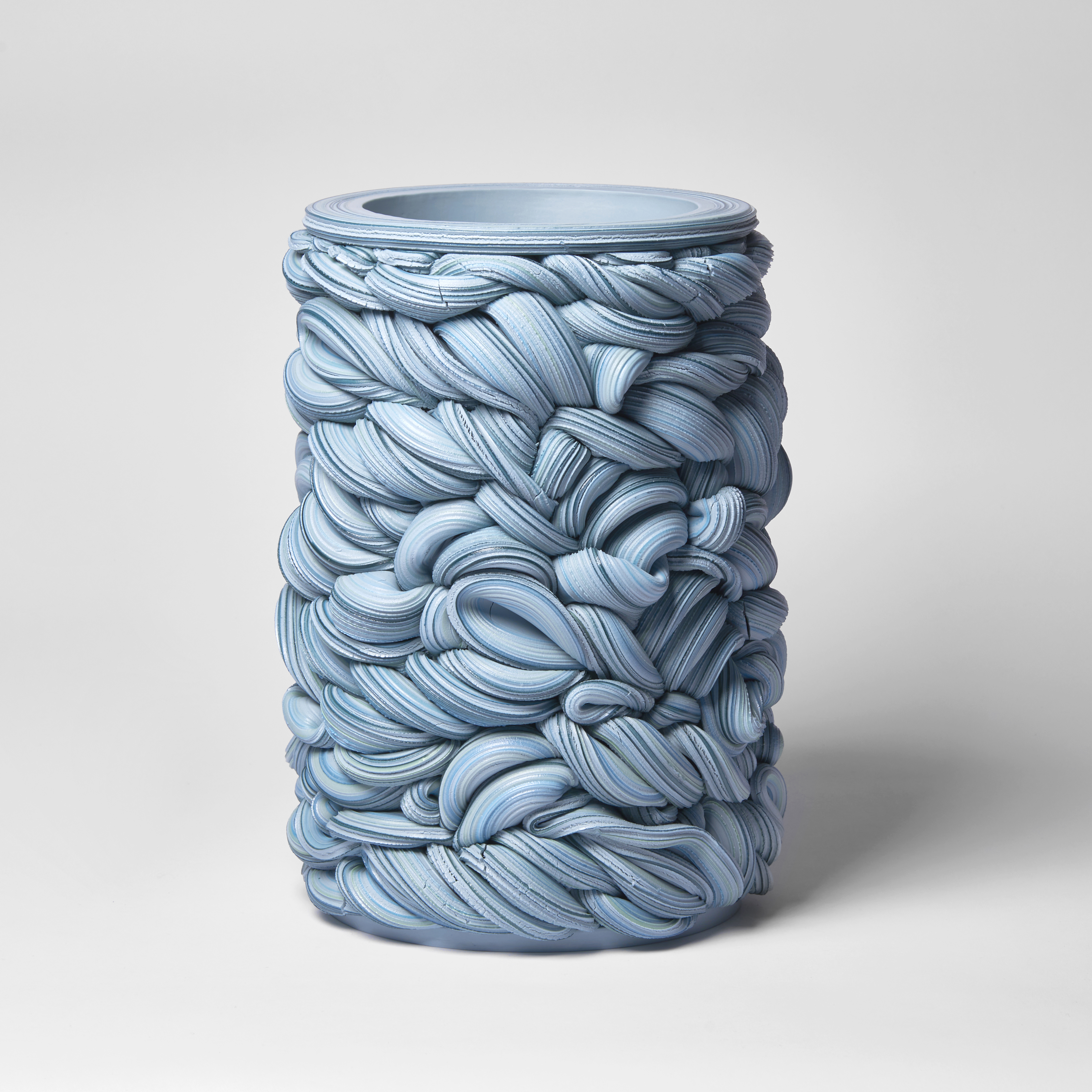 turquoise blue unevenly woven tubular vessel handmade from parian porcelain